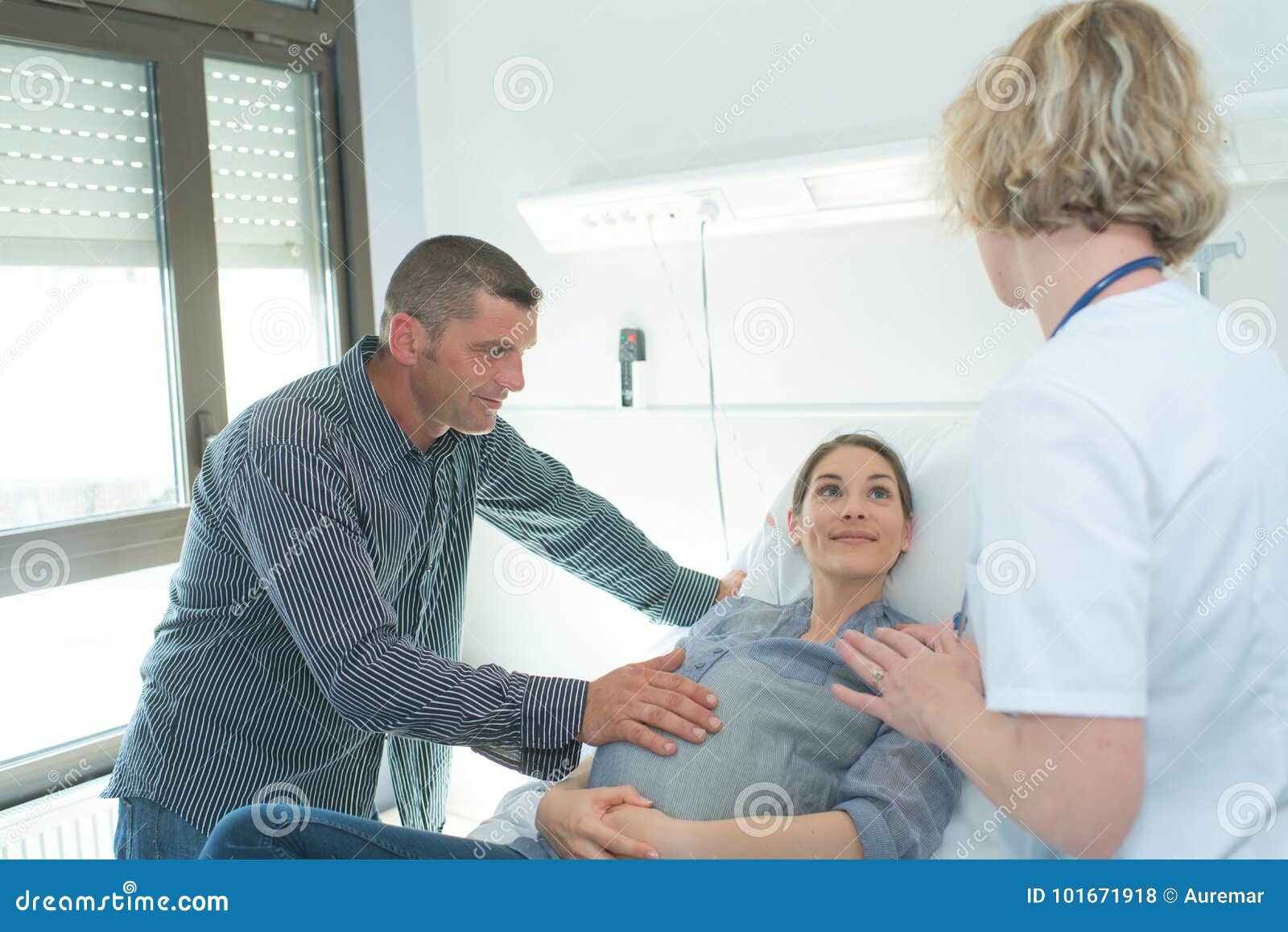 Doctor Husband and Pregnant Wife at Hospital Stock Photo