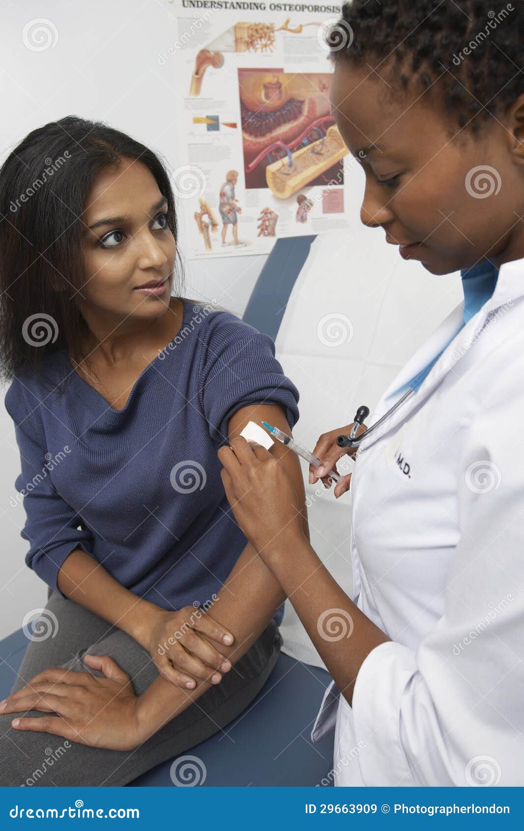 doctor injecting indian patient's arm