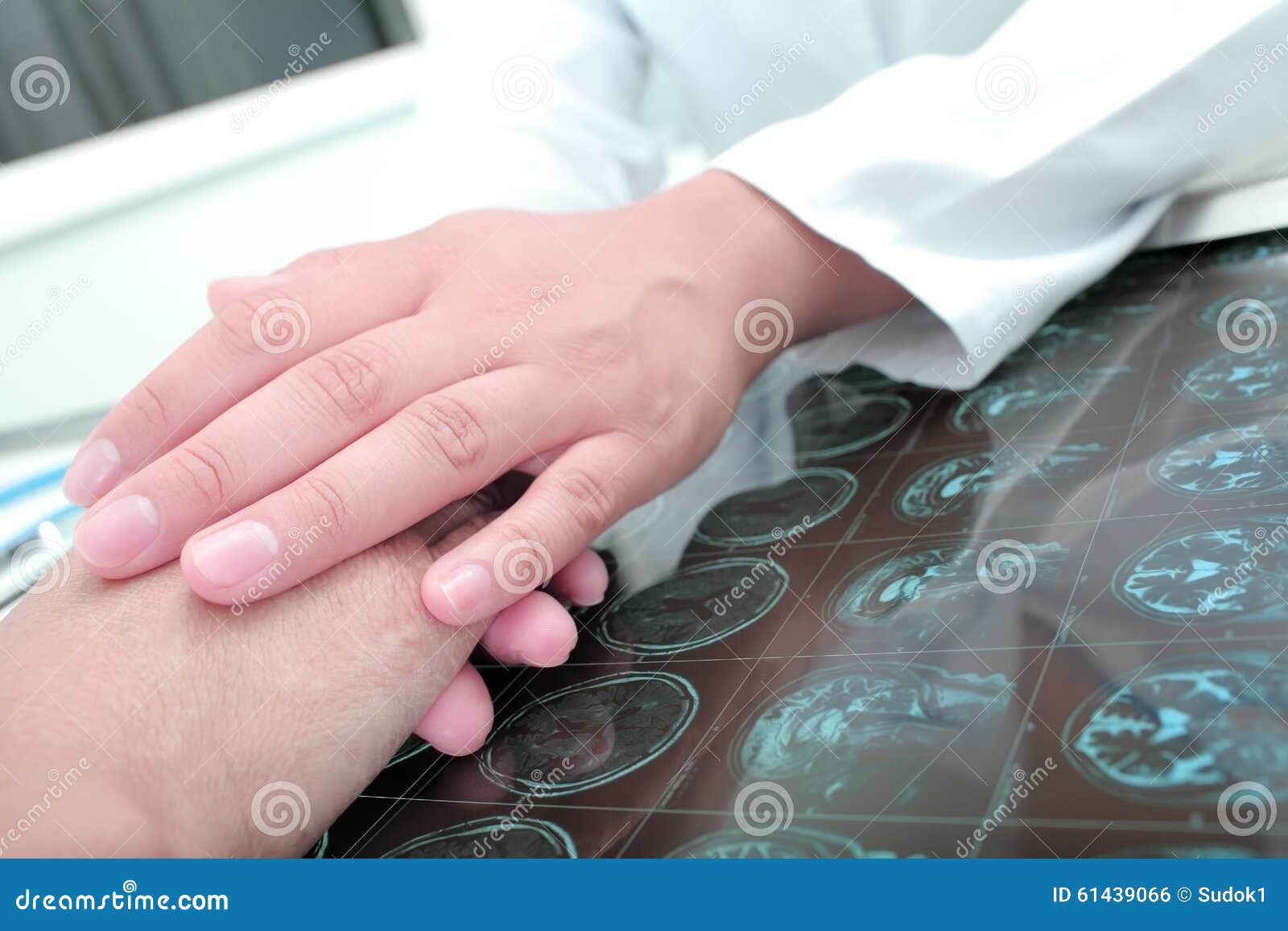 doctor keeps hands of his patient