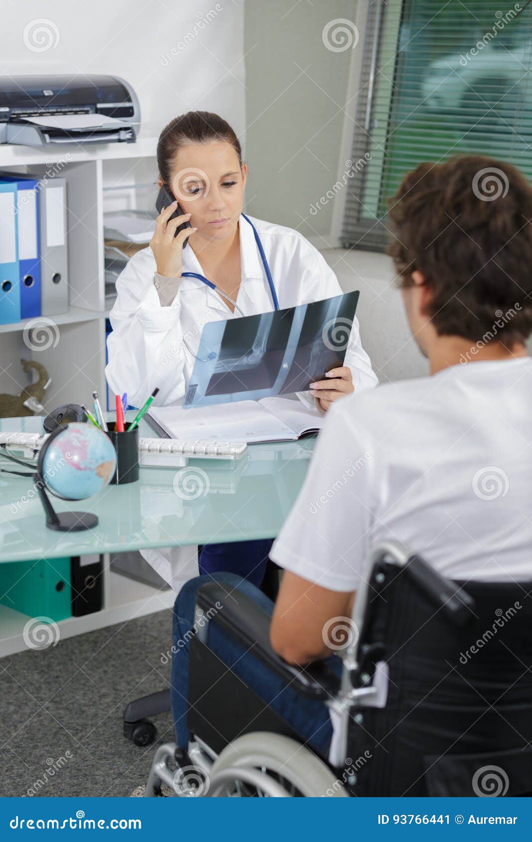 Doctor Looking at Xray Wheelchair Bound Patient Stock Image Image of