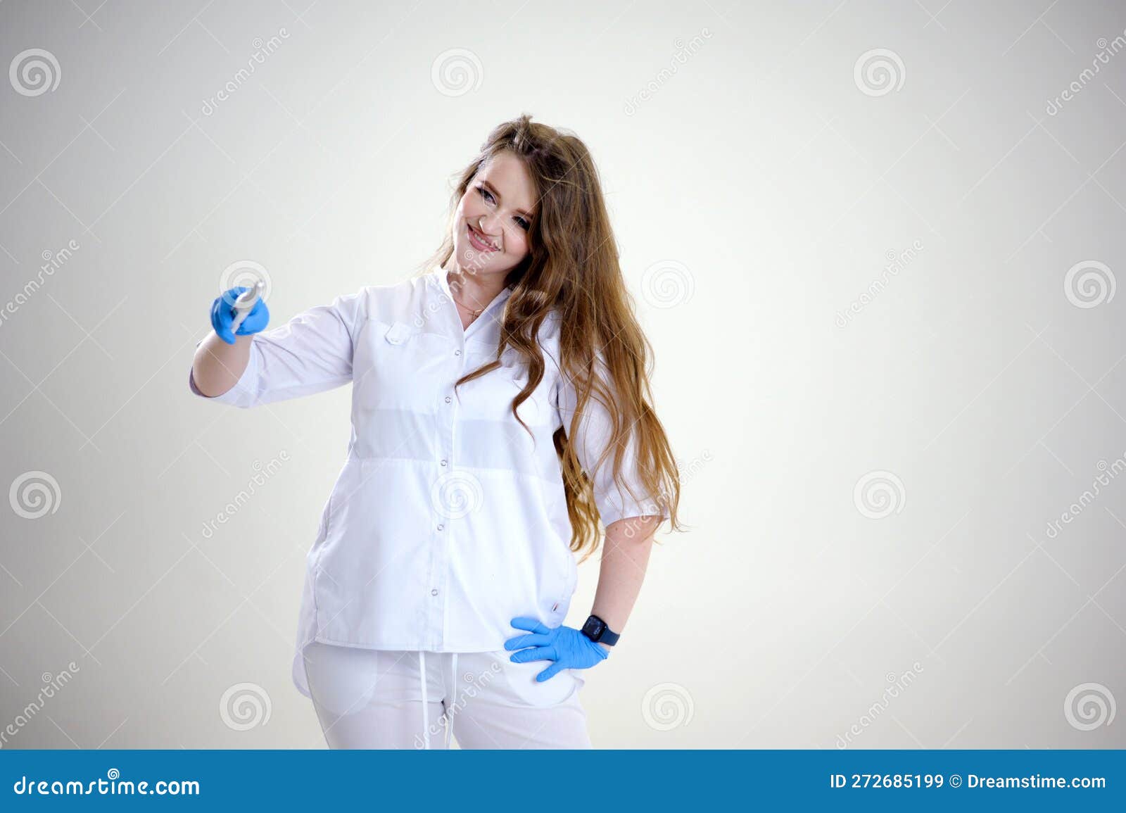 doctor with a magic wand in blue latex gloves loose hair conjures up a treatment. invents treatments advertisements for