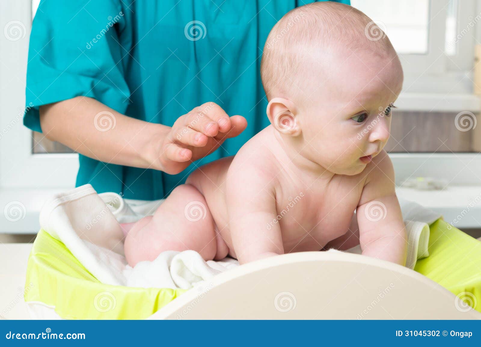 doctor massaging baby