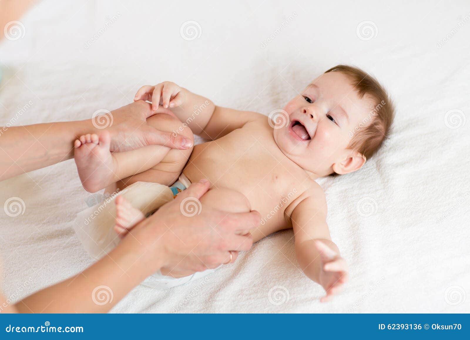 doctor massaging infant baby