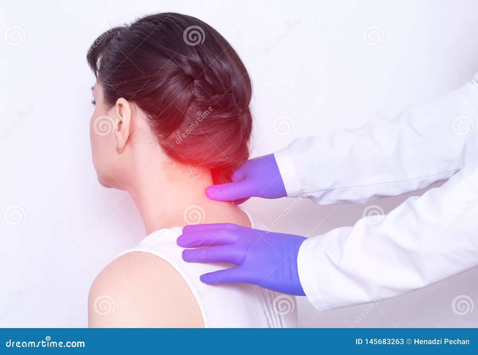 doctor neurologist examines the patient`s sore neck on a pinched nerve and protrusion of the spine, medical