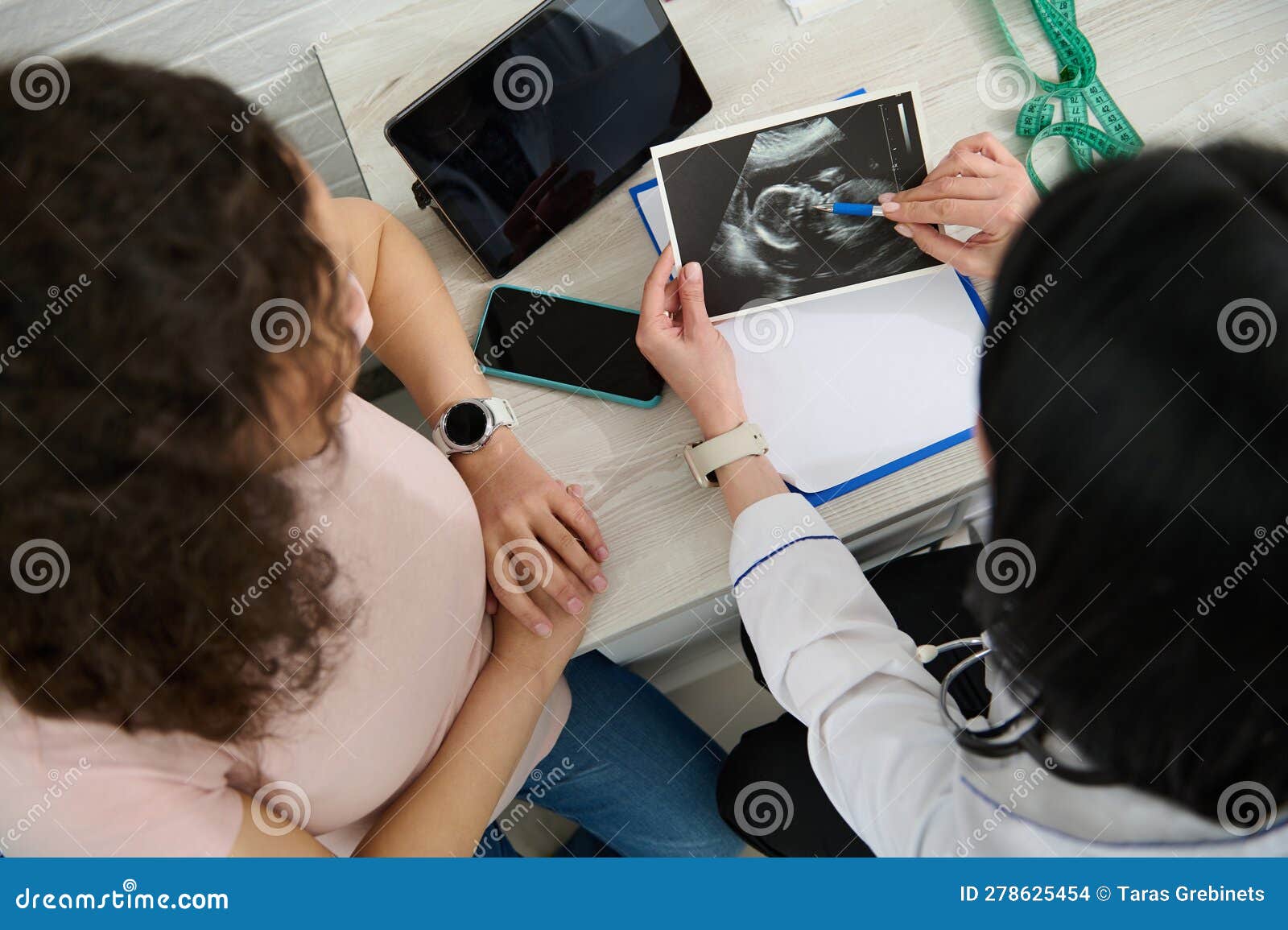 Doctor Obstetrician Gynecologist Holds Ultrasound Scan Explains To Pregnant Woman The 