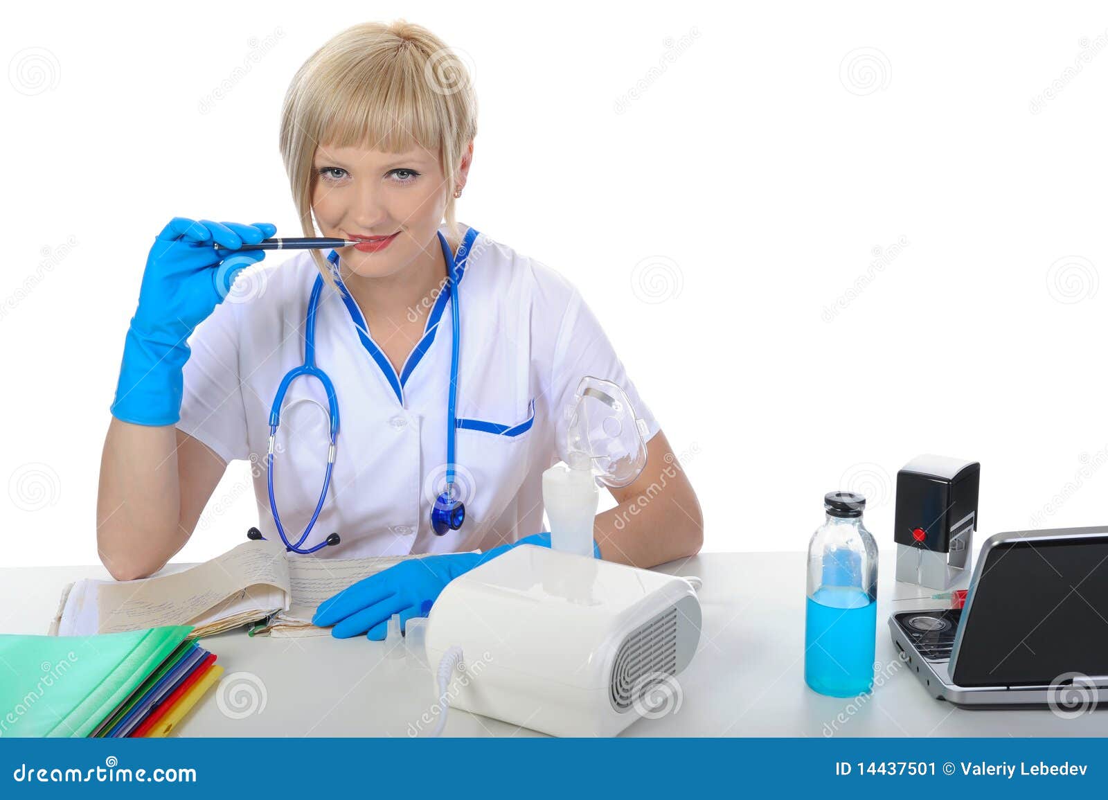 doctor in the office behind a desk.