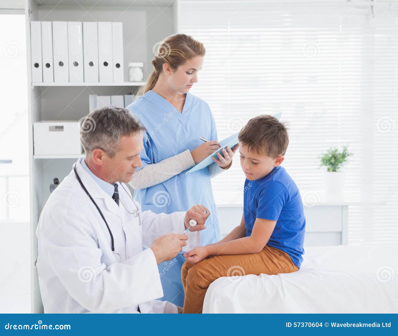 Doctor preparing an injection for his patient