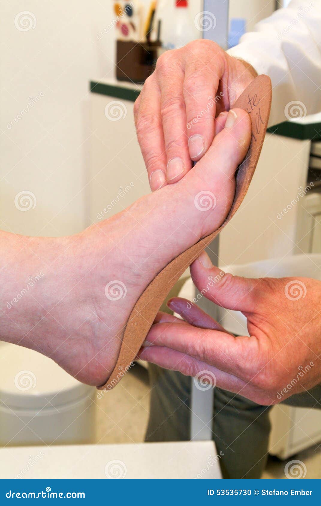 Doctor Preparing Orthopedic Insoles for a Patient Stock Photo Image