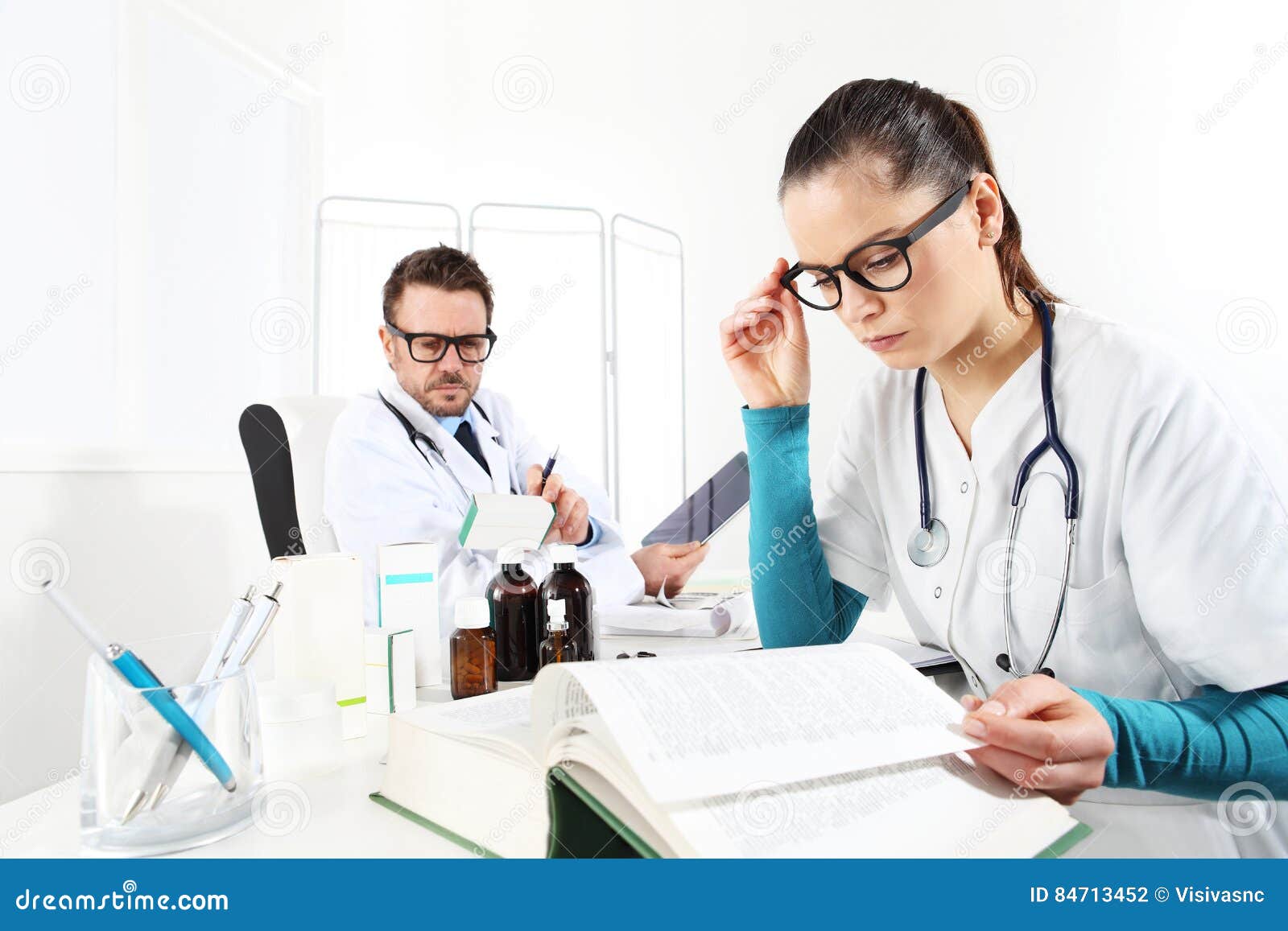 doctor prescribes prescription with the tablet and nurse read