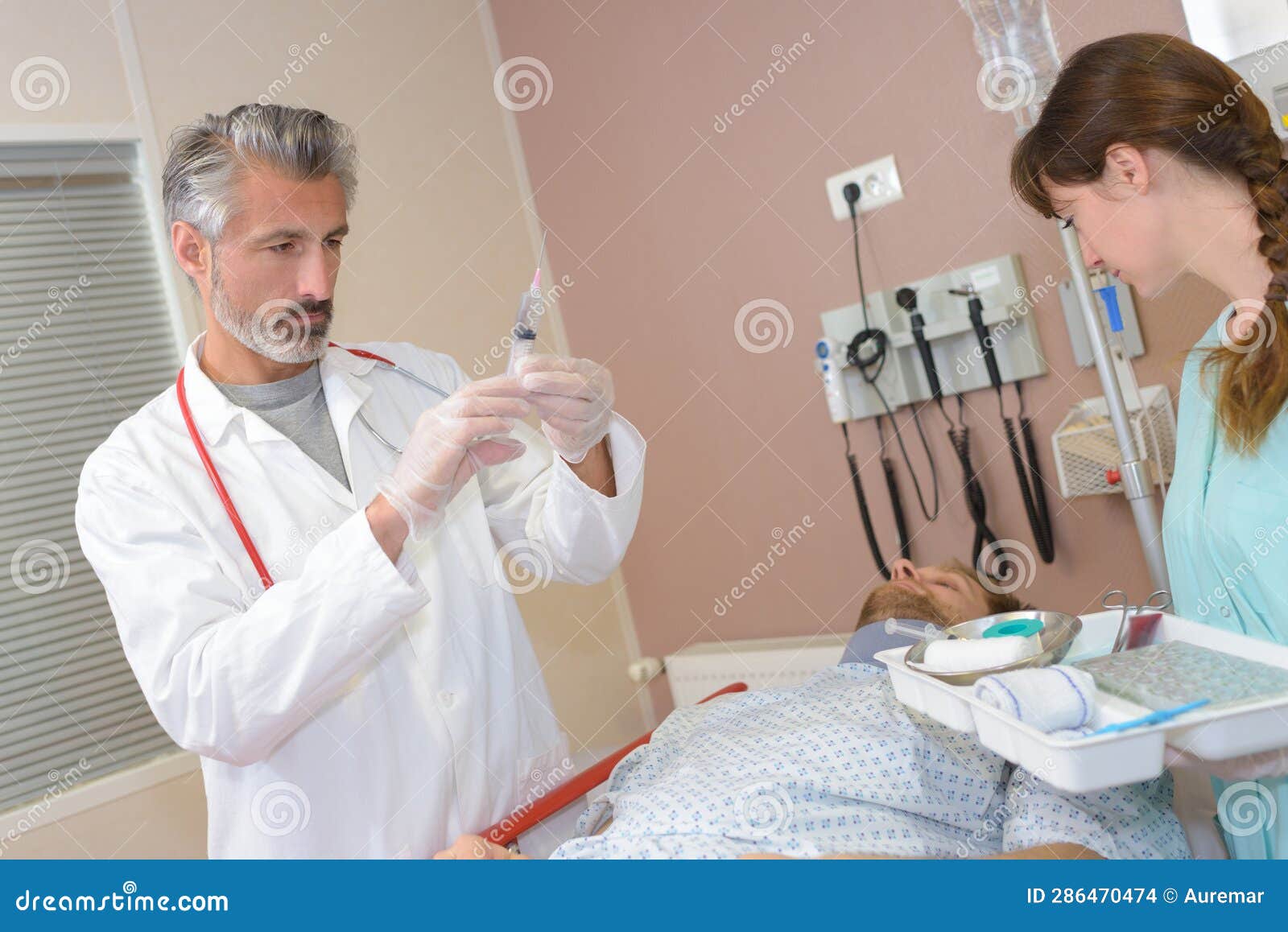 doctor raedy ti give injured man tetanus toxoid injection