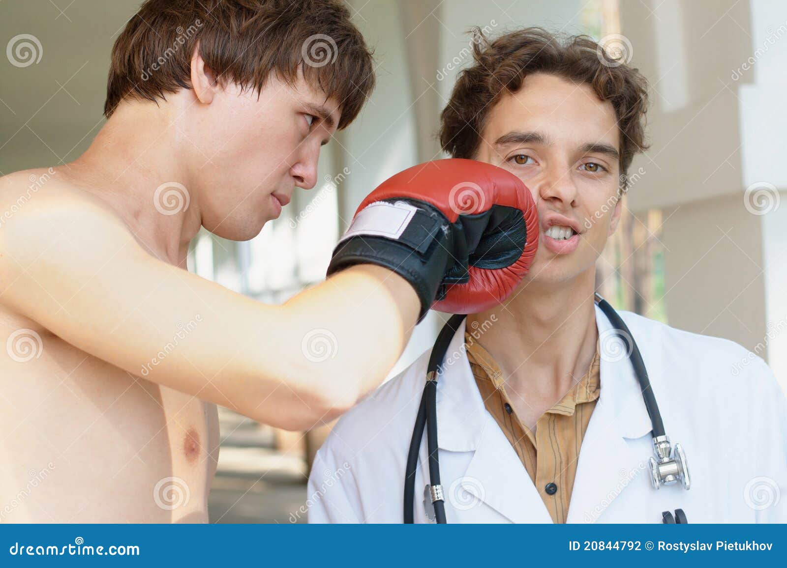 Doctor Receiving a Punch from Angry Boxer Stock Photo Image of