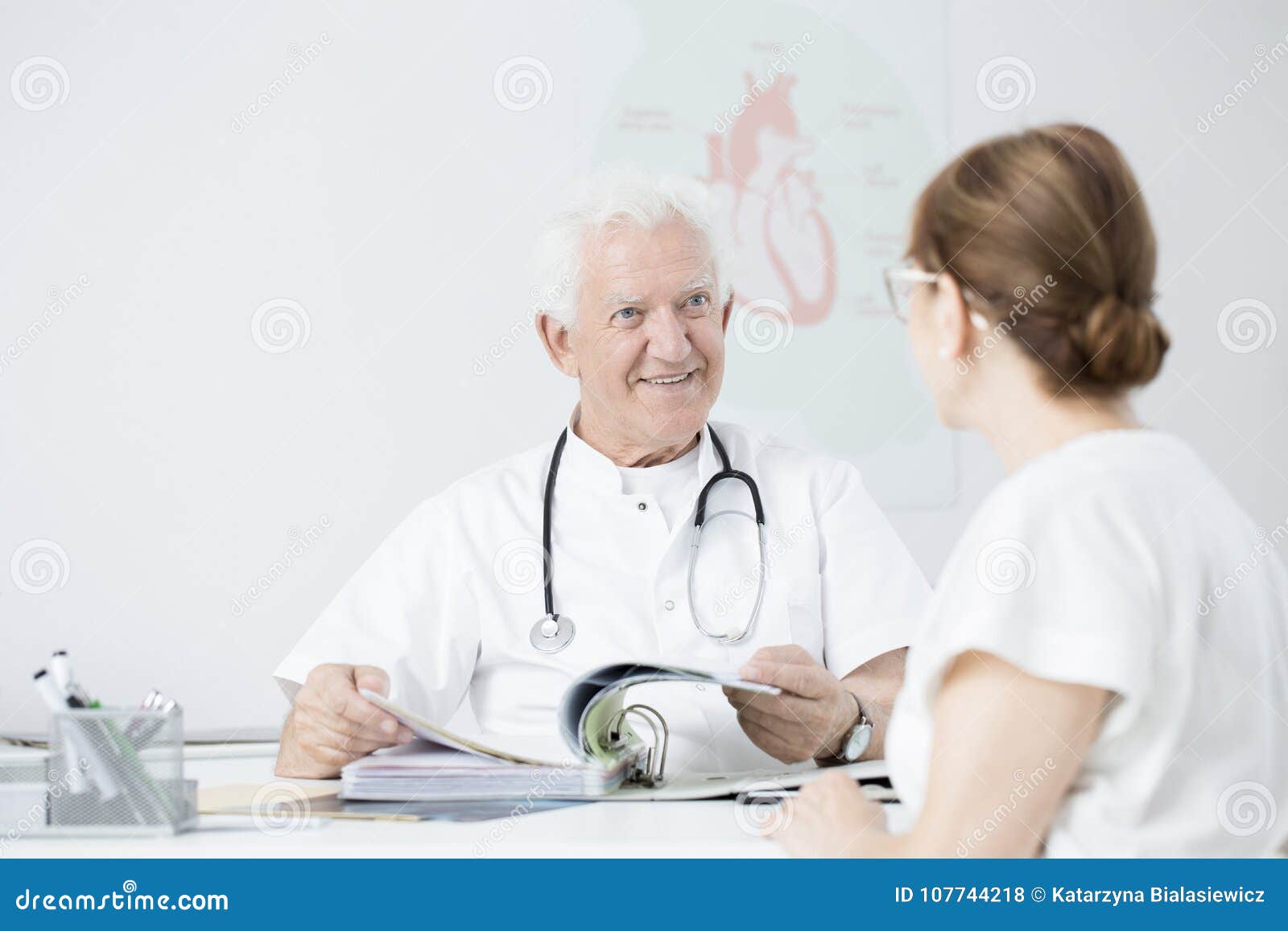 doctor showing sanatorium brochures