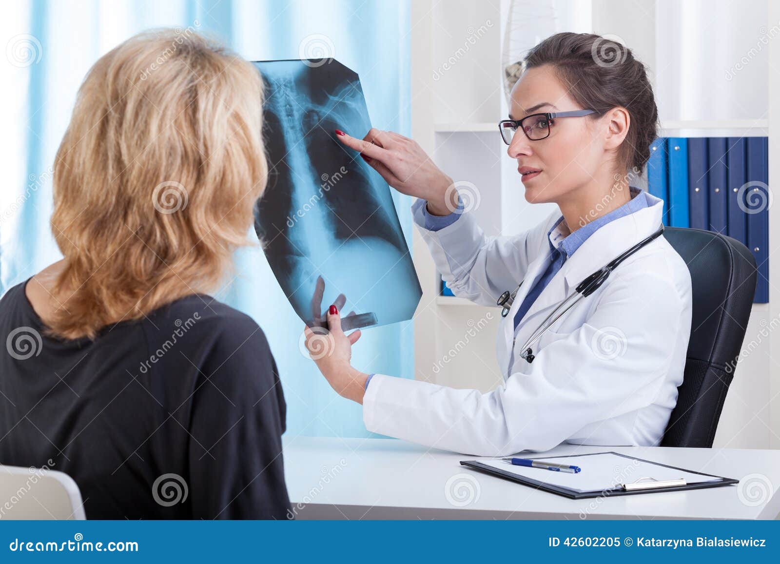 Doctor shows chest xray stock image. Image of care, beautiful 42602205