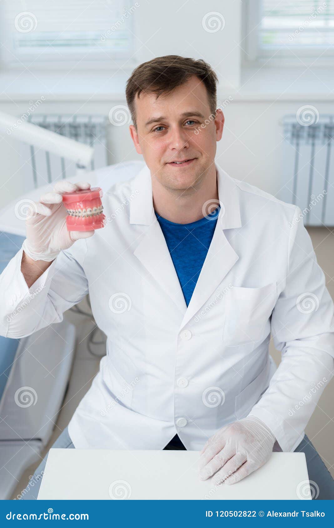 Doctor Orthodontist Shows How the System of Braces on Teeth is Arranged