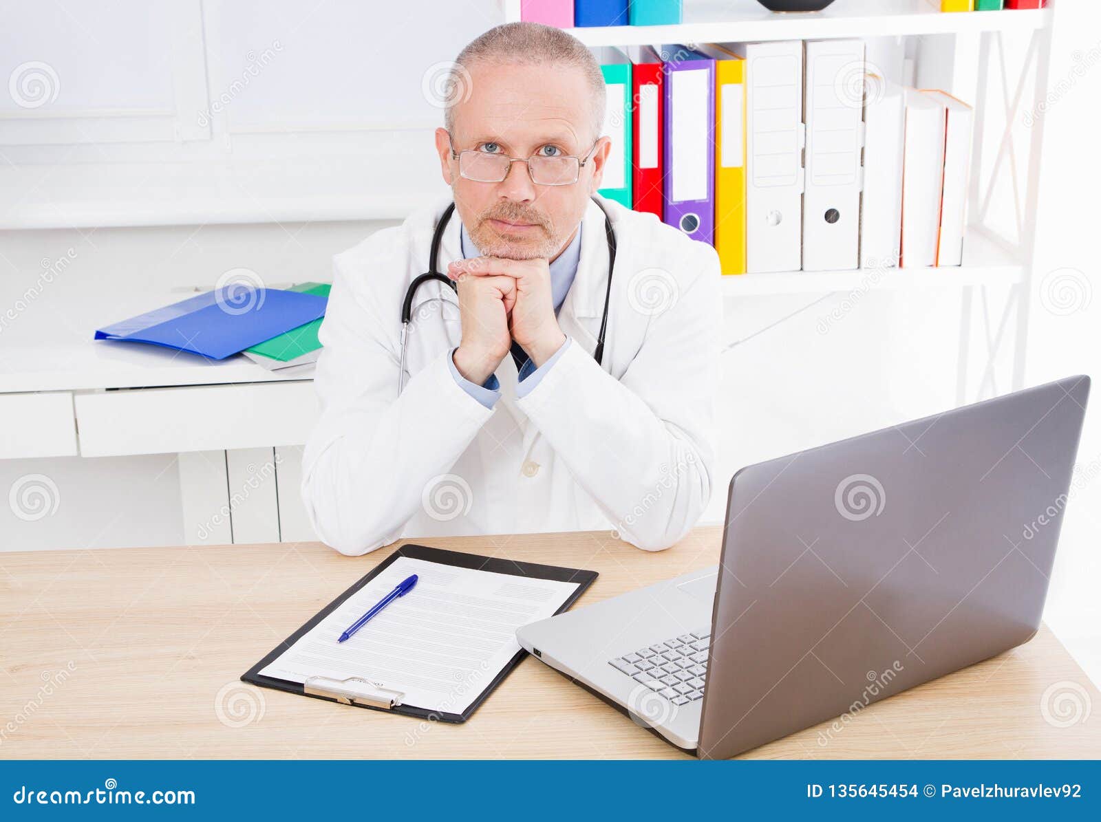 Doctor Sits in a Clinic at the Table Stock Photo - Image of medicare ...