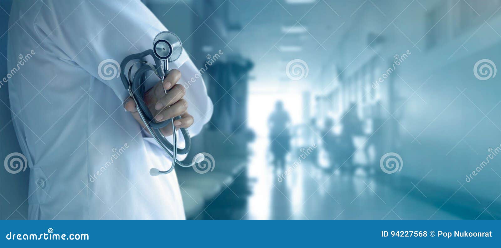 doctor with stethoscope in hand on hospital background