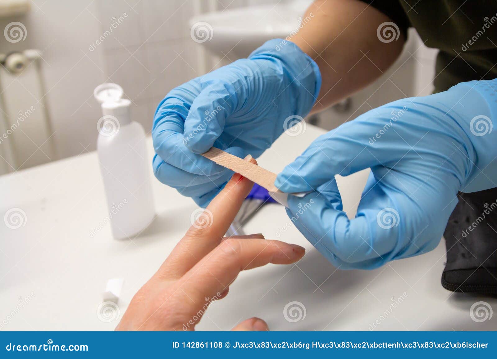 A Doctor Sticks a Plaster on a Finger Stock Photo - Image of emergency