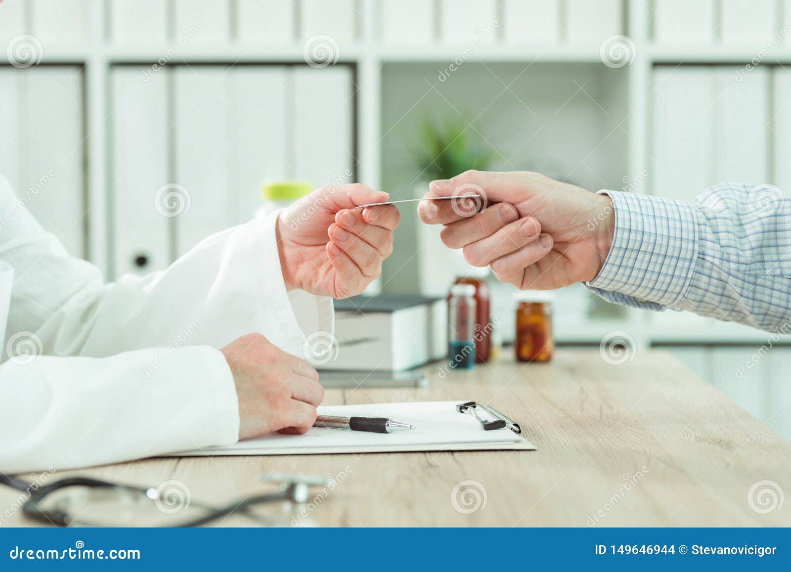 Doctor Taking Medical Insurance Card from Patient Stock Photo Image Doctor Taking Medical Insurance Card from Patient Stock Photo Image