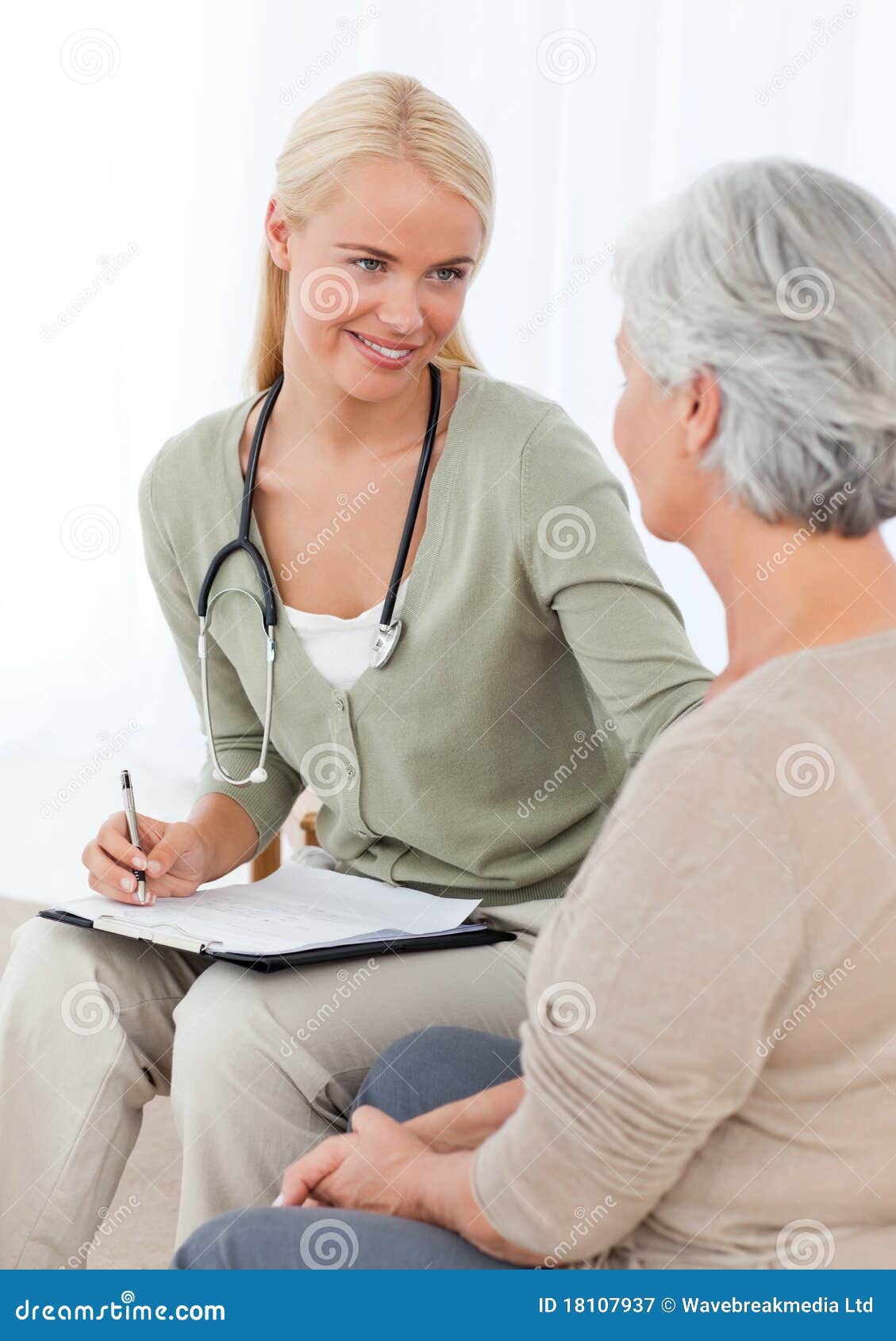 Pretty doctor talking with her patient