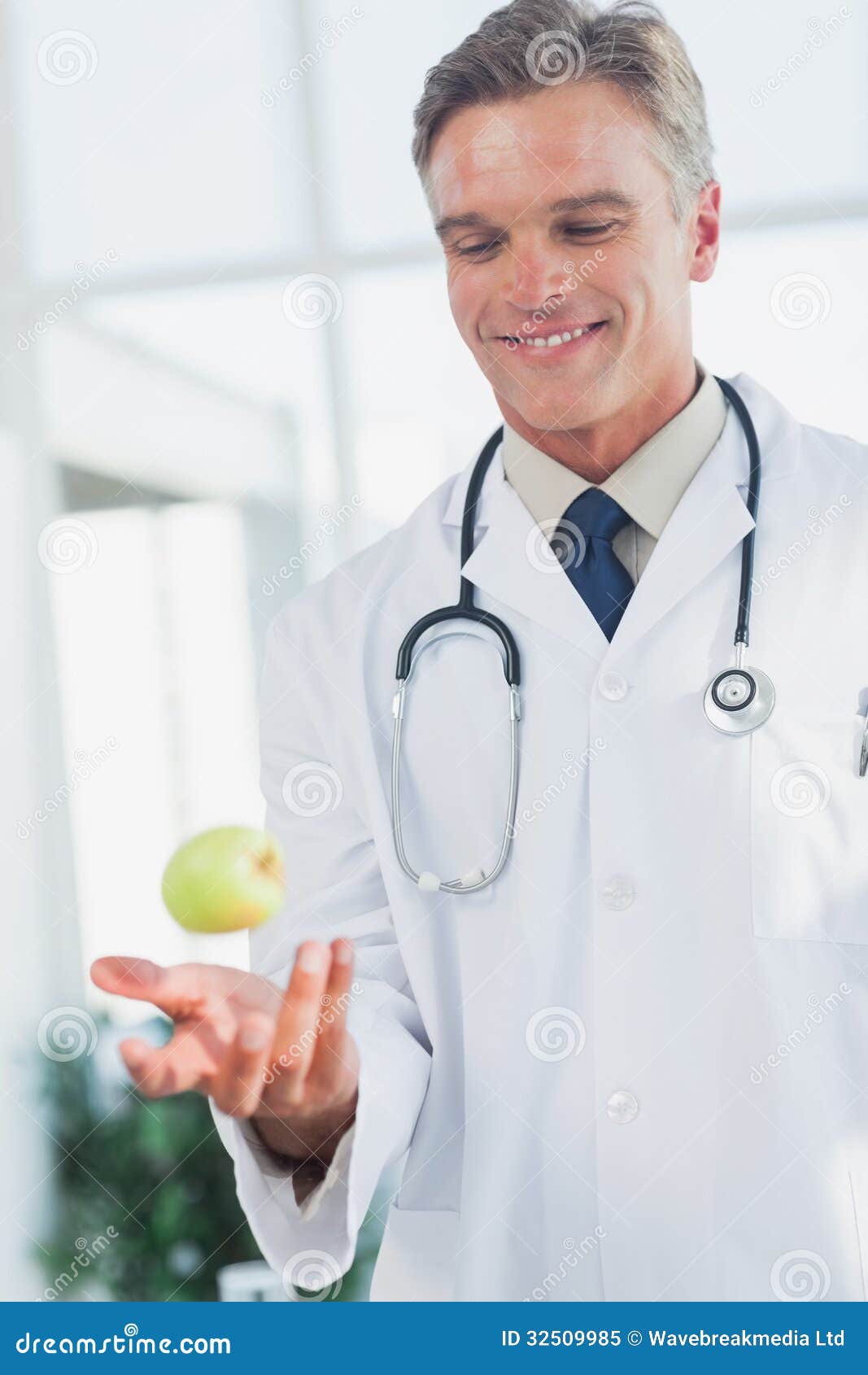 Doctor throwing an apple stock image. Image of medical 32509985