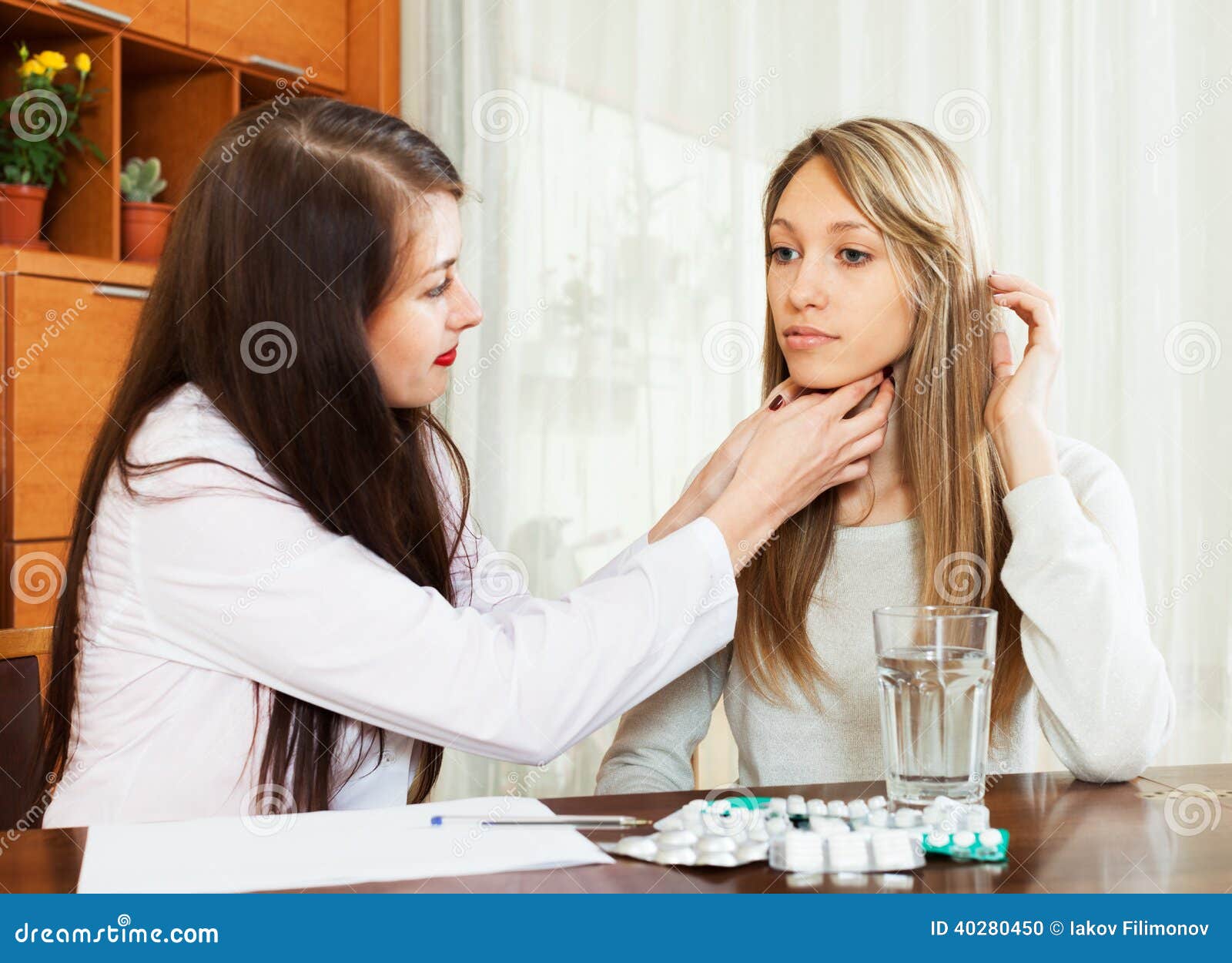 Doctor touching gizzard of woman. Focus on patient