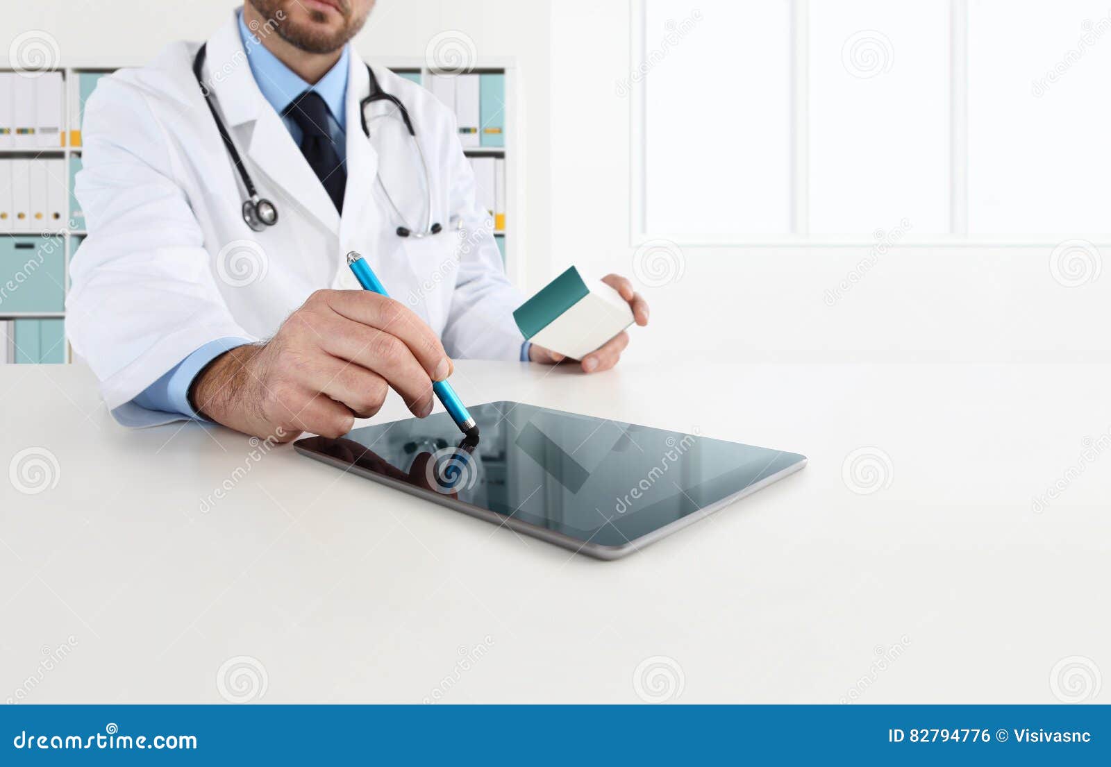 doctor using tablet on desk office prescribes the medicine
