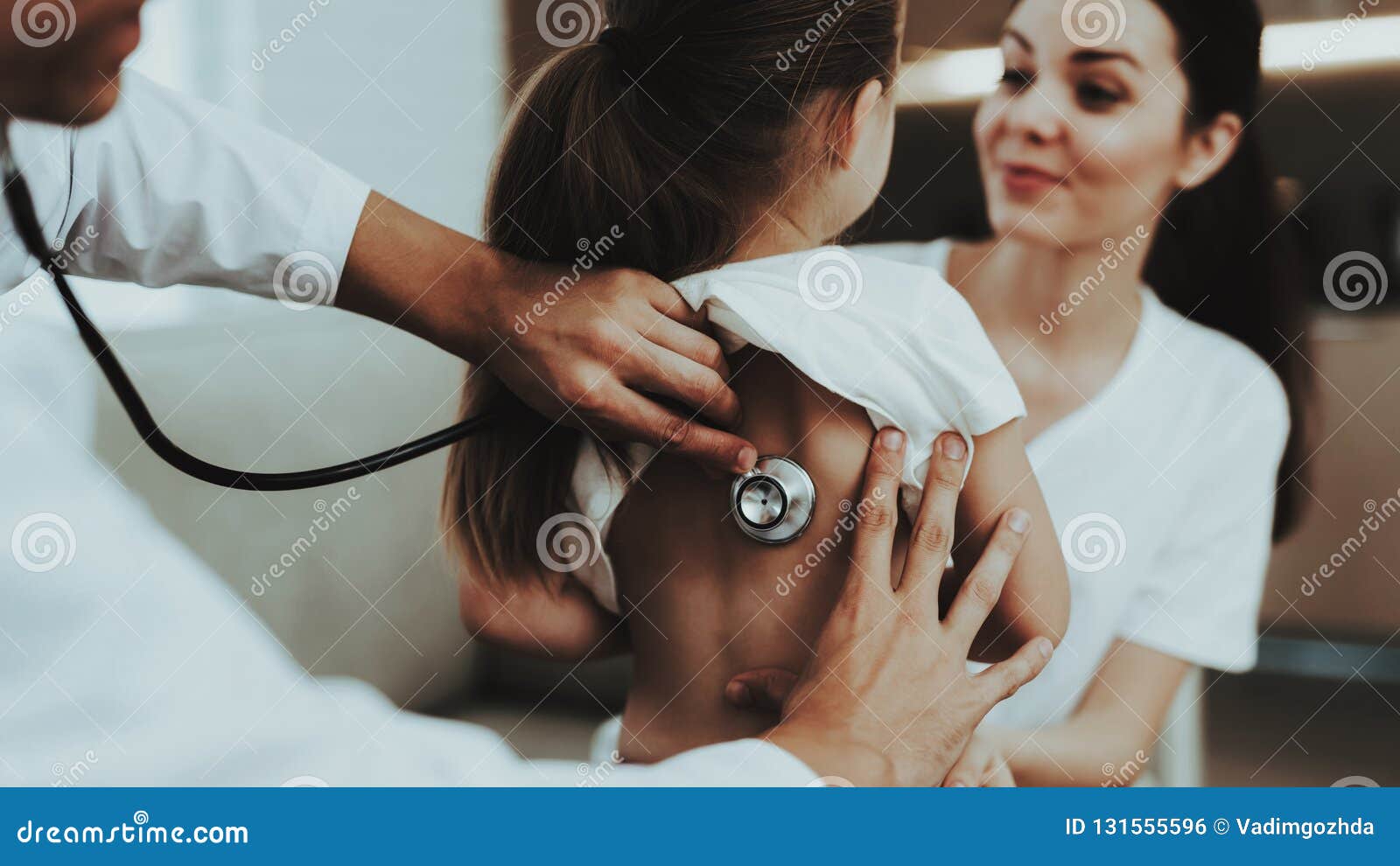 Doctor Visiting Little Girl In Red Scarf With Cold Sick Young Girl