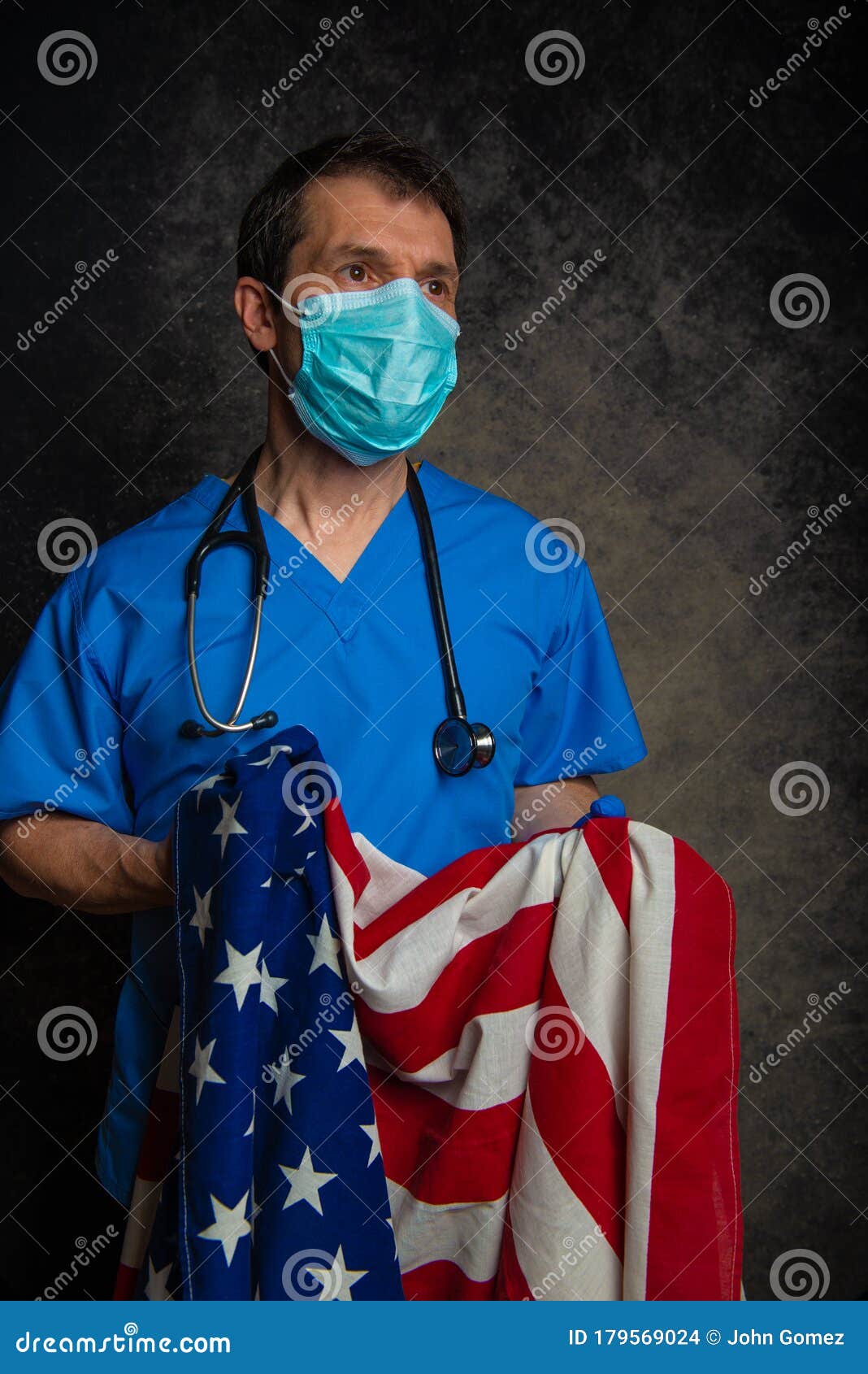 Doctor Wearing Surgical Mask Holding the American Flag. Stock Photo ...