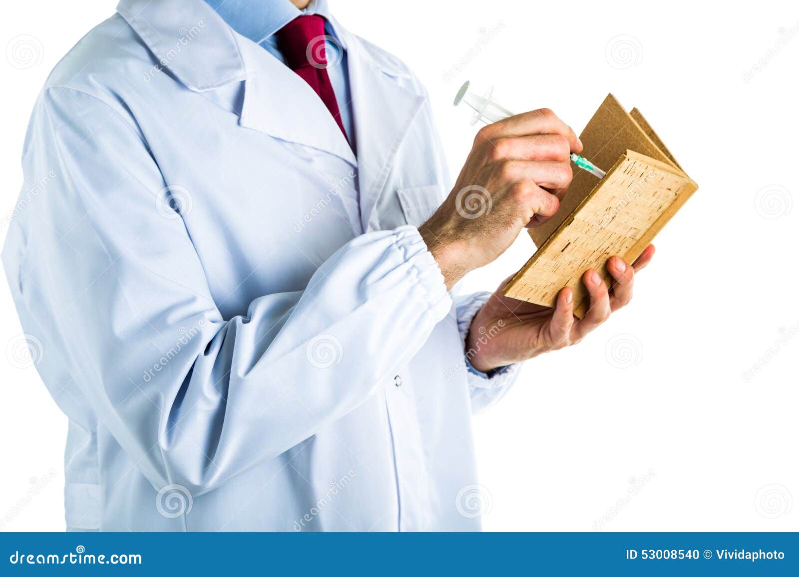 Doctor In White Coat Writing In Cork Book With Syringe Stock Photo ...