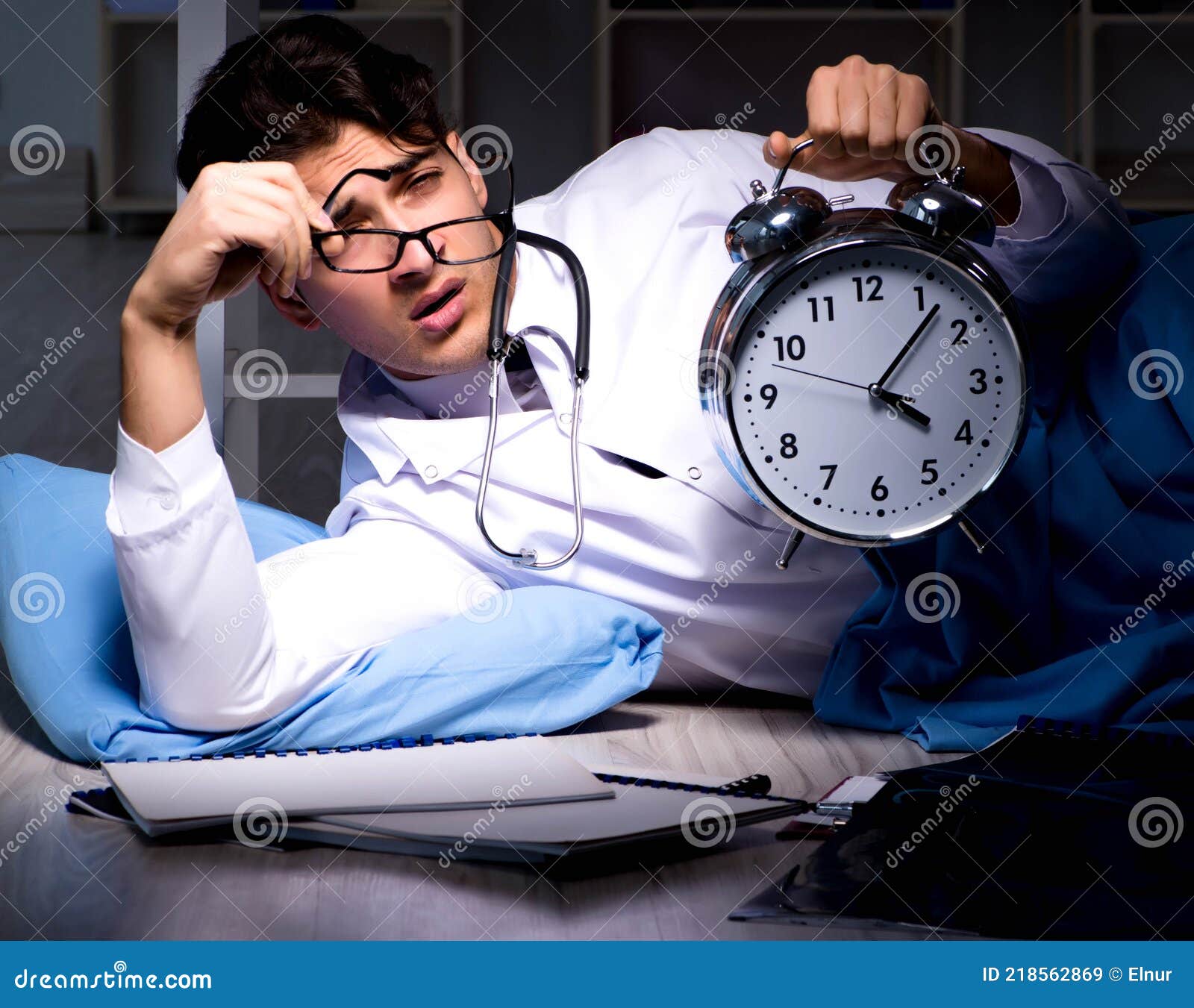 Doctor Working Night Shift in Hospital after Long Hours Stock Image