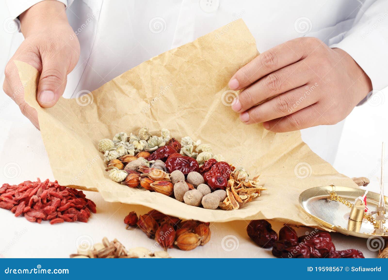 Doctor Wrapping Chinese Herbal Medicine. Royalty Free Stock Photography