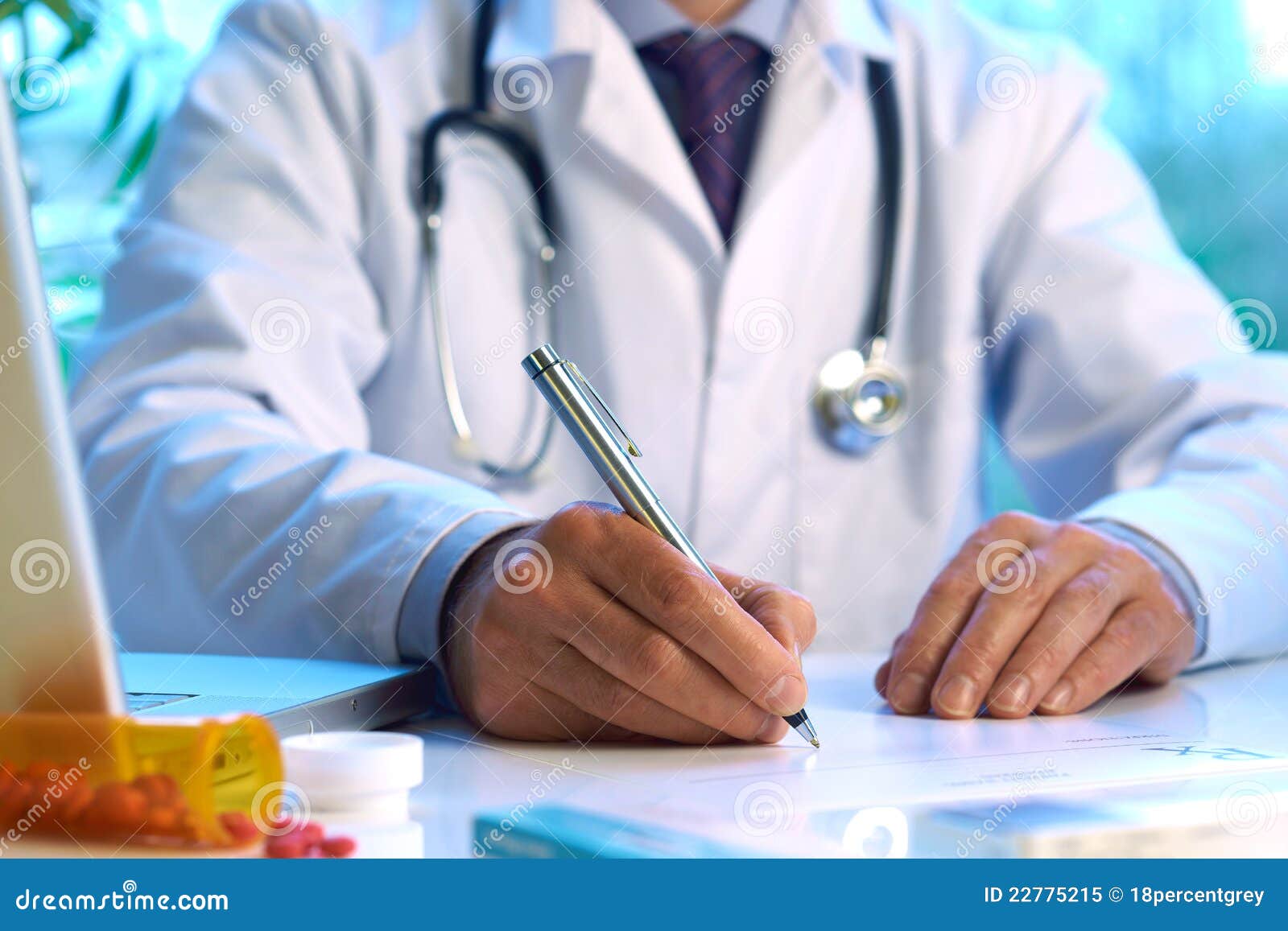 doctor writing prescription