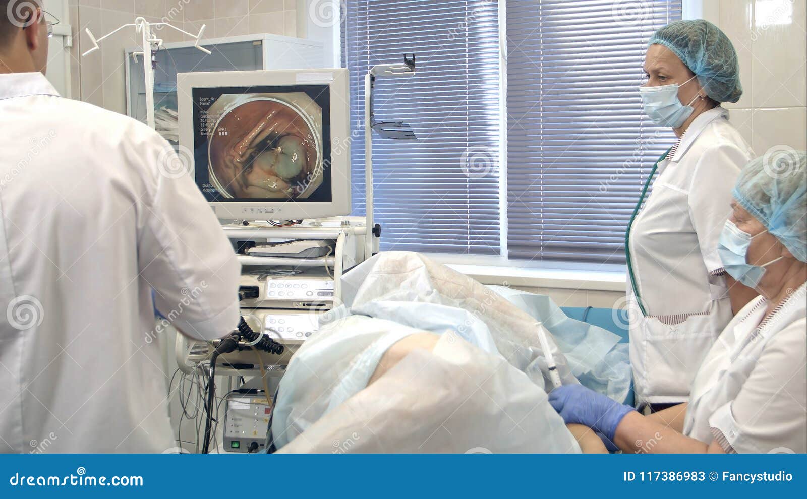 Doctors Conducting Surgery Using Endoscope Stock Image Image of