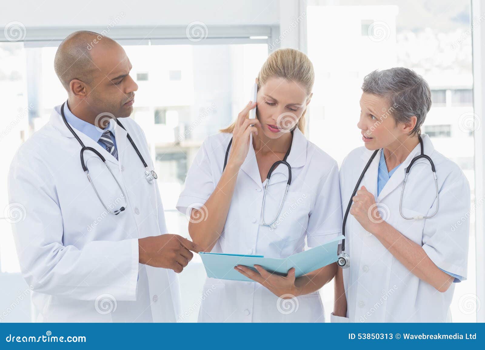 Doctors Having an Important Phone Call Stock Image Image of indoors
