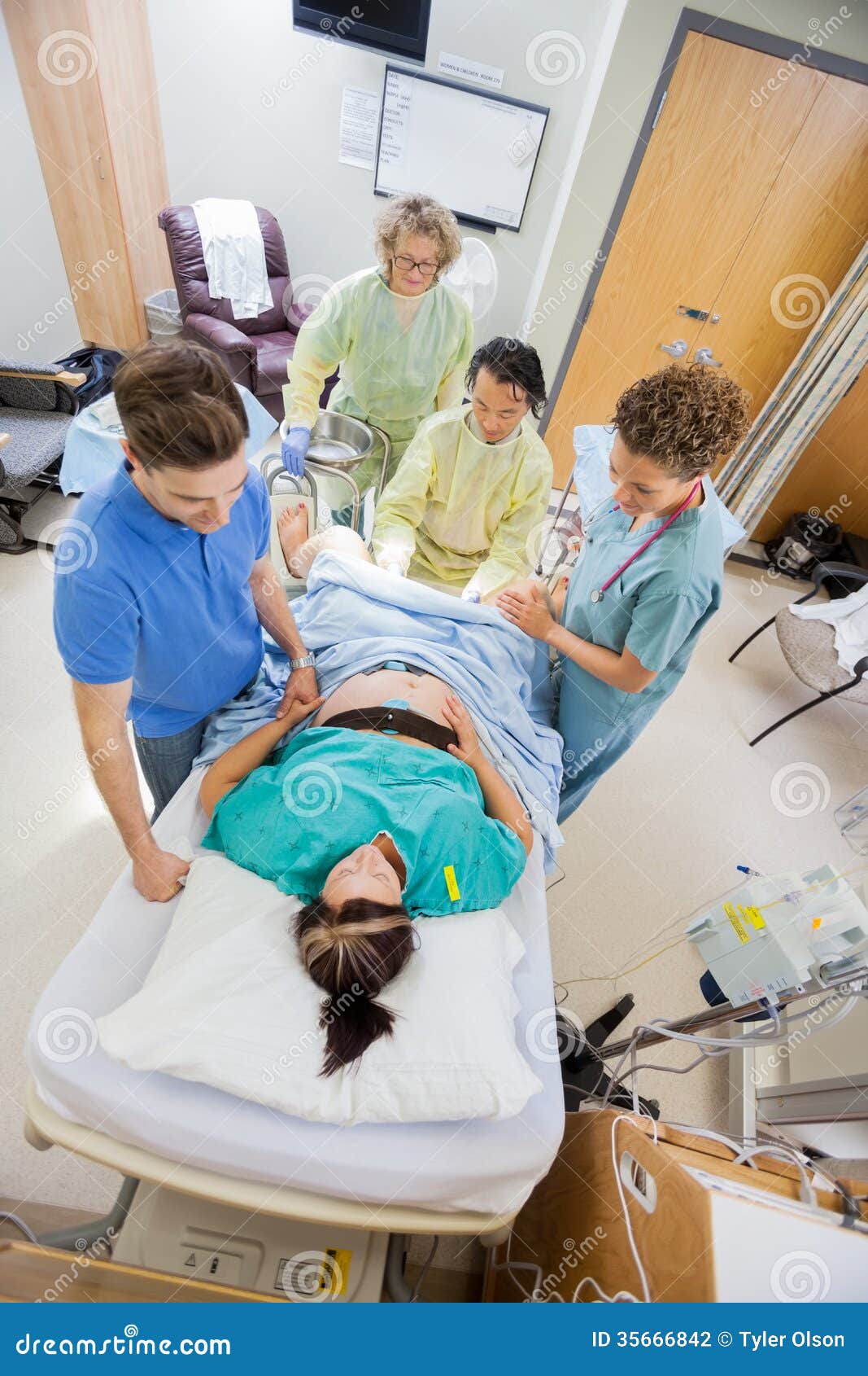 Doctors With Nurse Operating Pregnant Woman During Stock Photo - Image