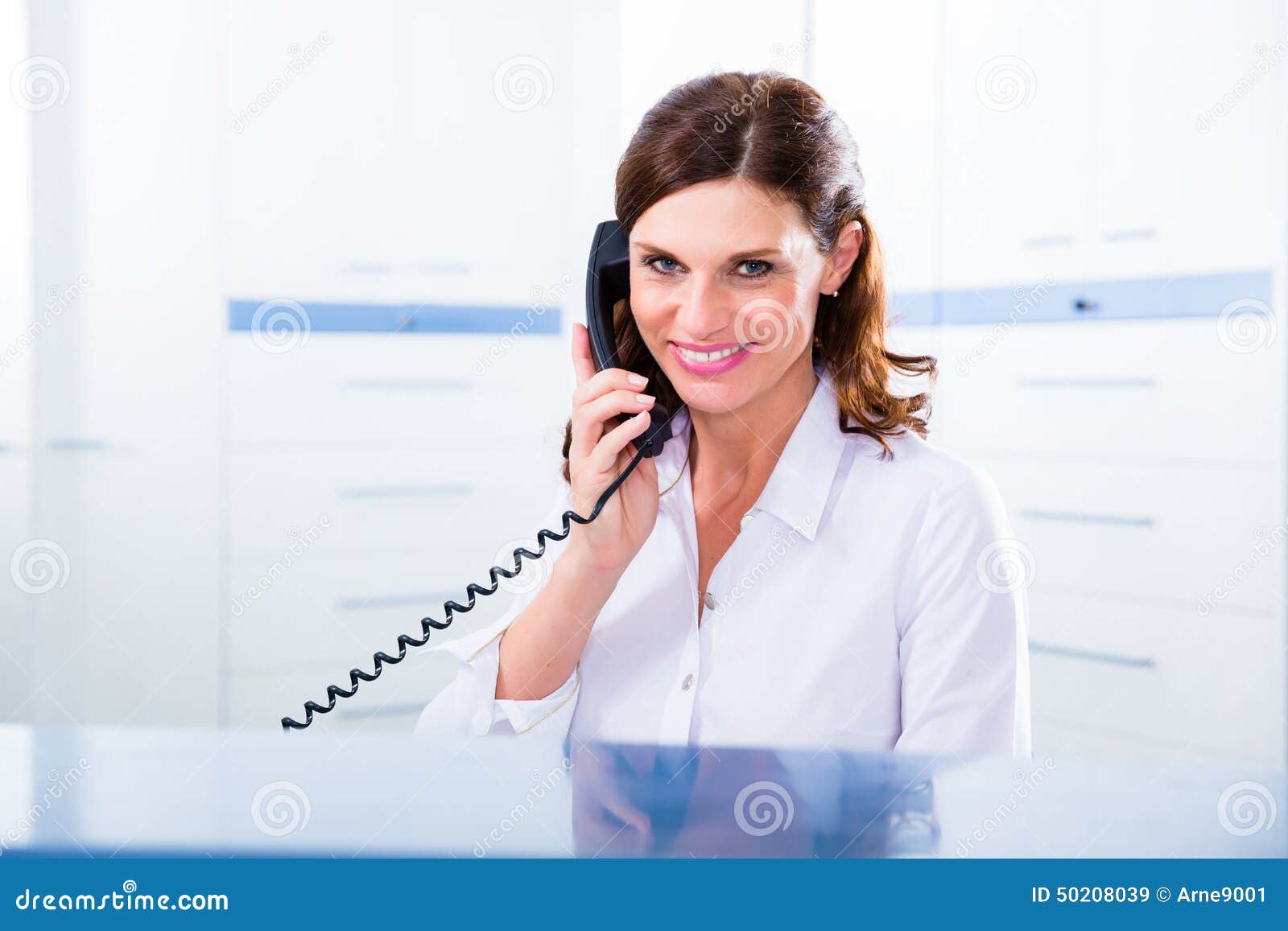 Doctors Nurse with Telephone in Front Desk Stock Image Image of