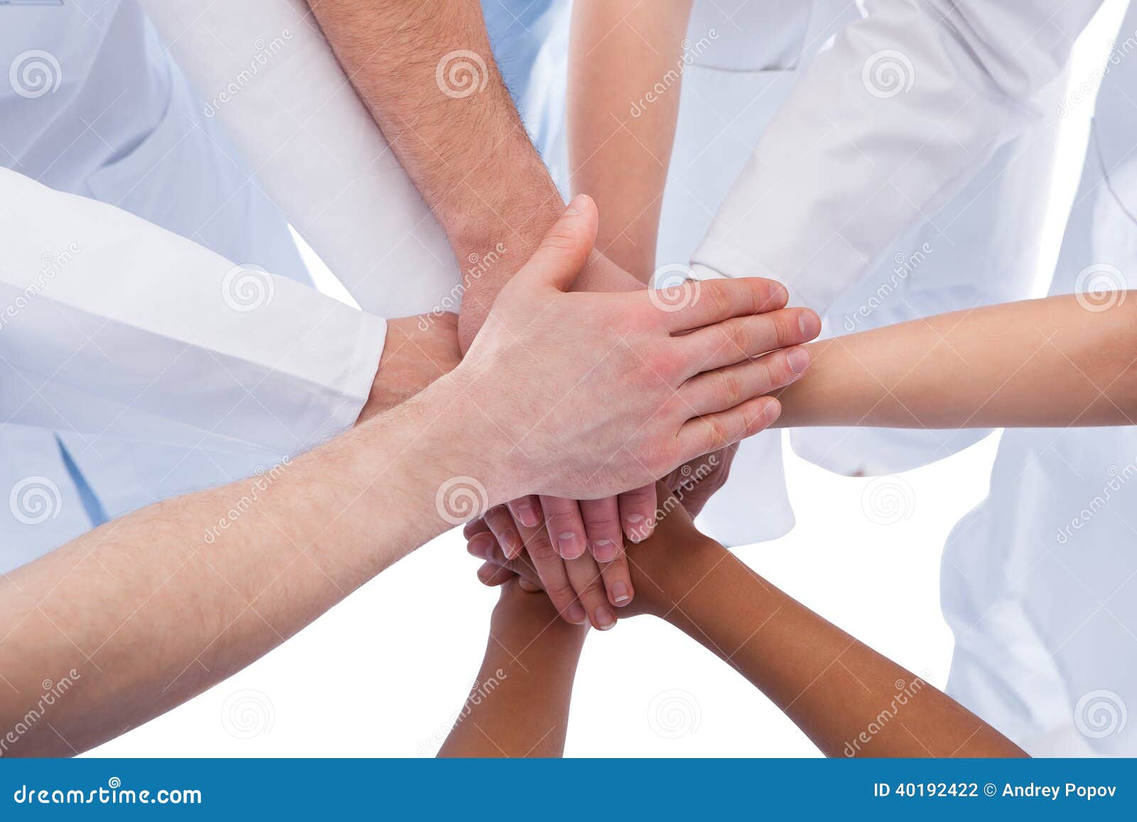 doctors and nurses stacking hands