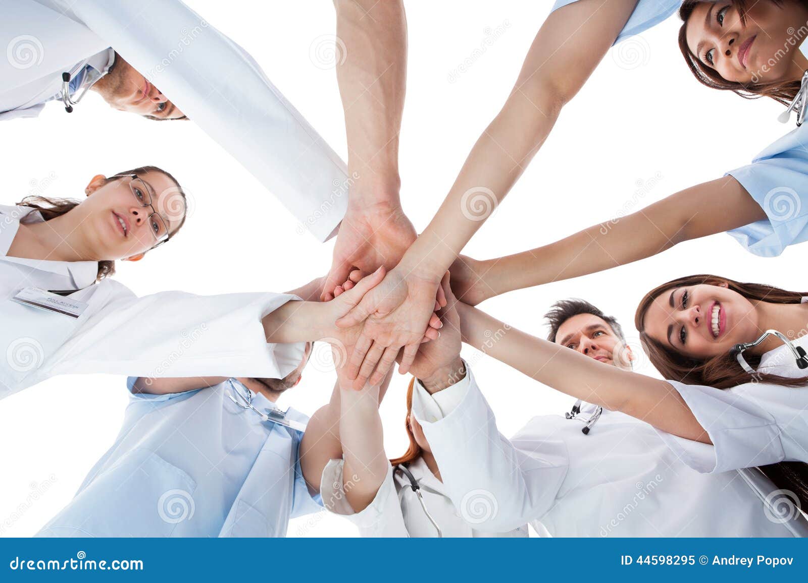 doctors and nurses stacking hands