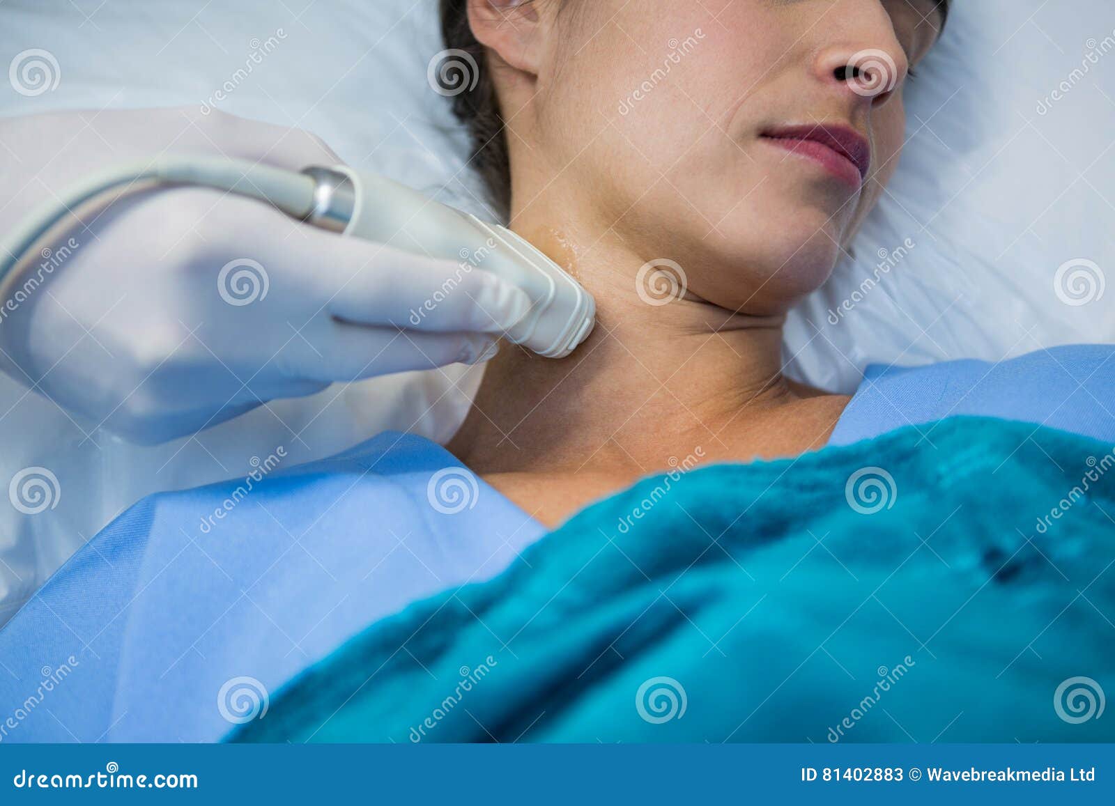 doctors performing a doppler sonography on patient