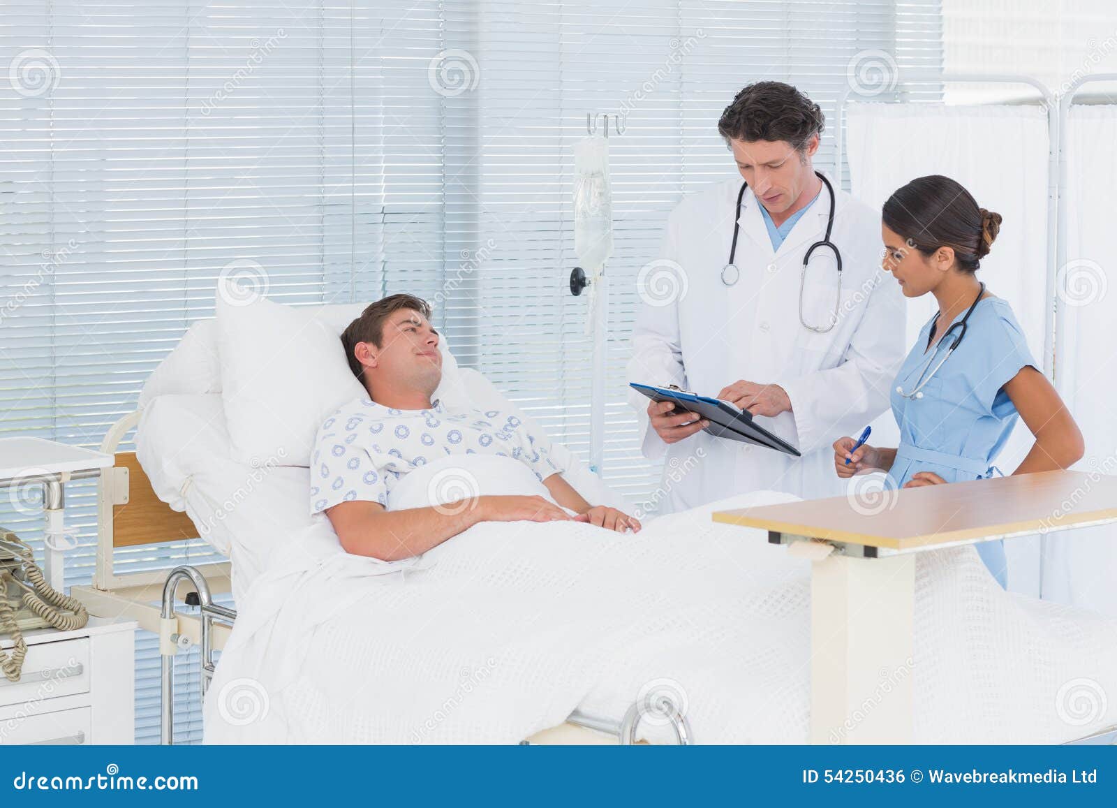 Doctors Taking Care of Patient Stock Photo Image of lying, examination 54250436