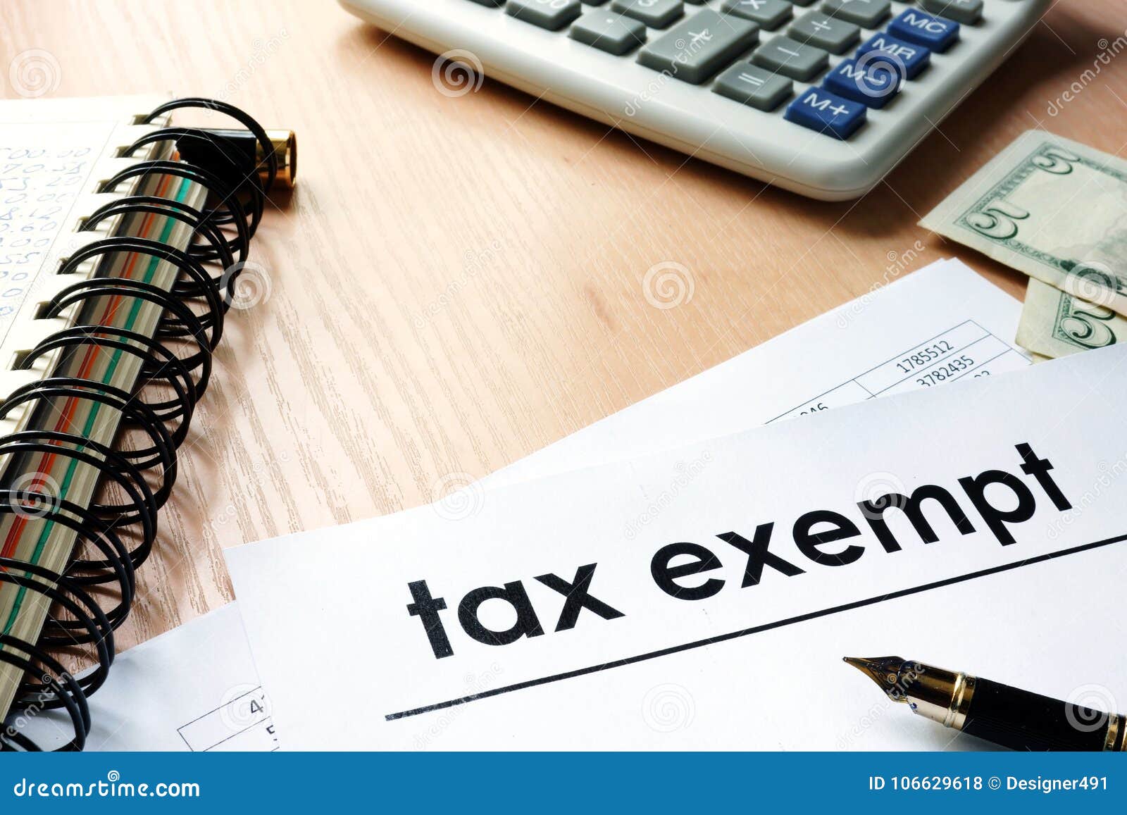 documents with title tax exempt on a table