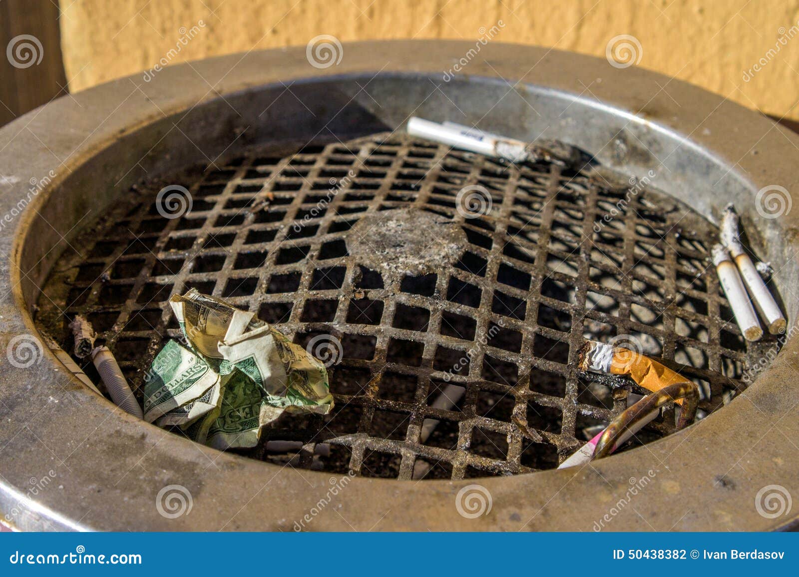 Dollar in an ashtray stock photo. Image of bill, lose 50438382