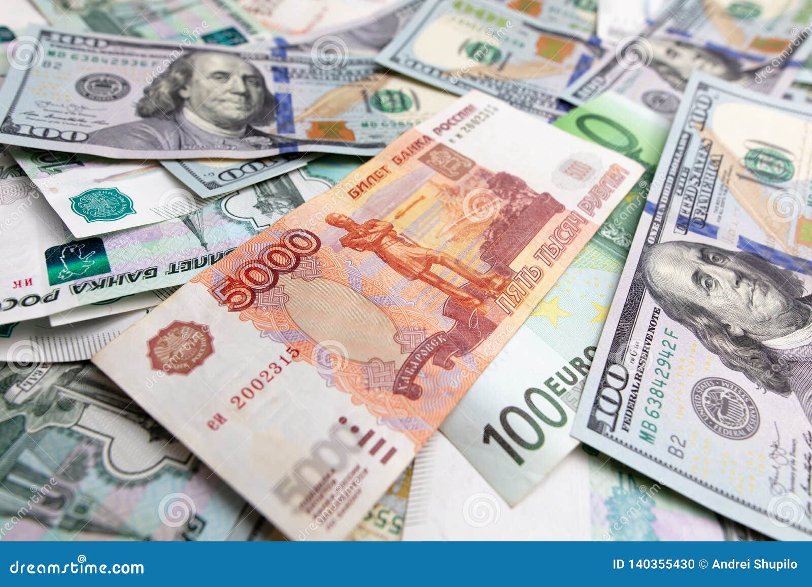Dollars And Russian Rubles On The Table As Background Stock Photo dollars-and-russian-rubles-on-the-table-as-background-stock-photo
