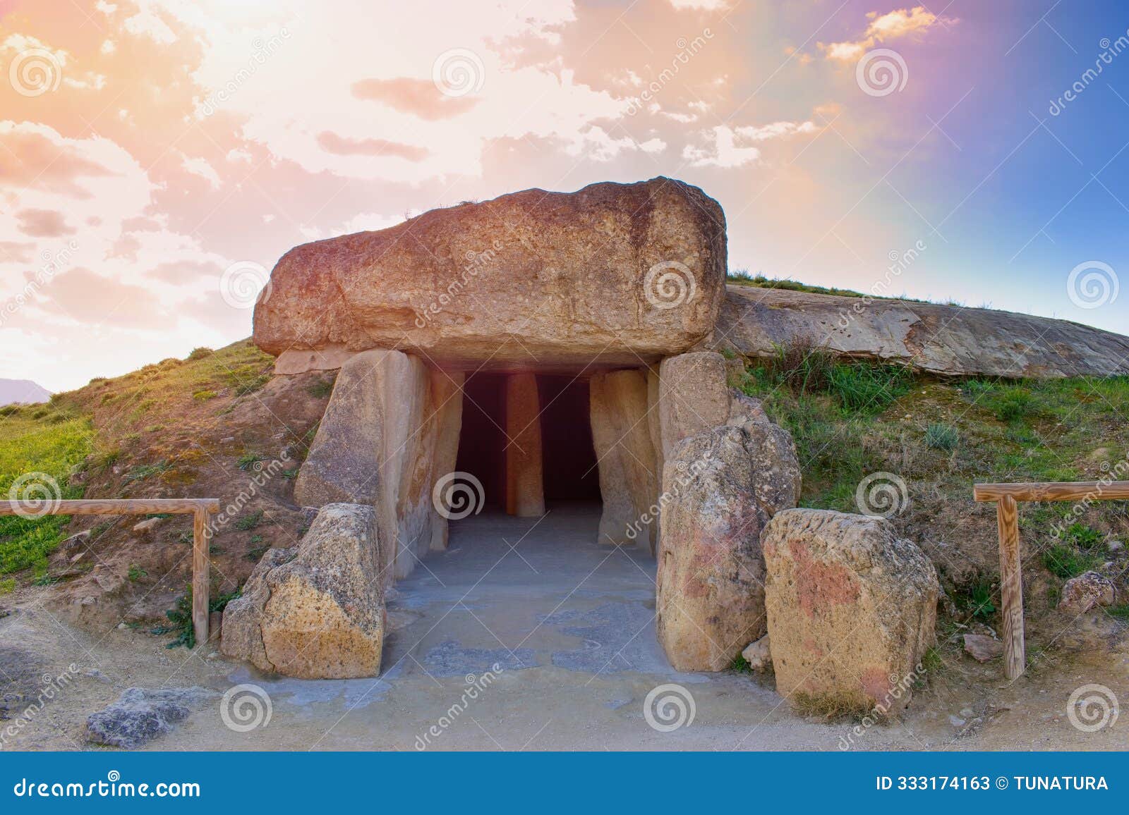 dolmen de menga - exterior of megalithic burial tumulus. one of the largest known ancient megalithic structures in europe