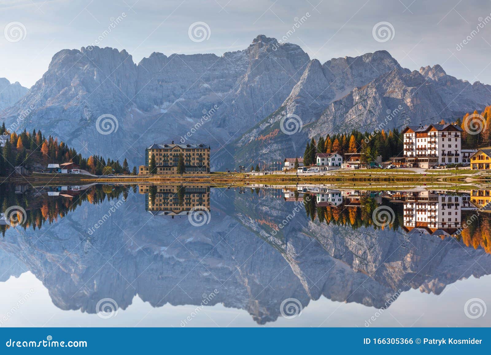 dolomites mountains reflected in the lago mi misurina lake at autumn, south tyrol. italy