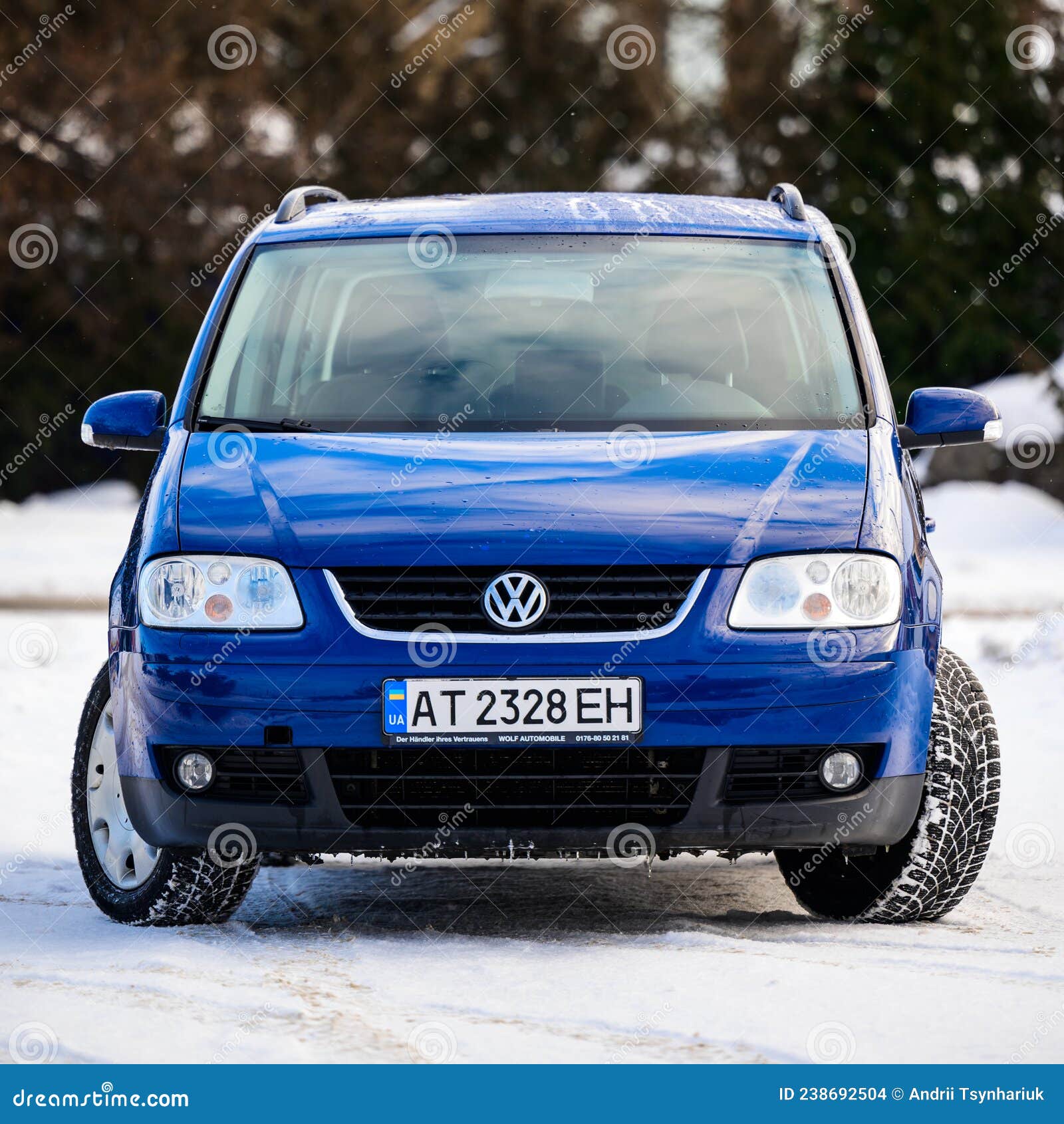 Dolyna, Ukraine December 22, 2021: Volkswagen Touran and Car