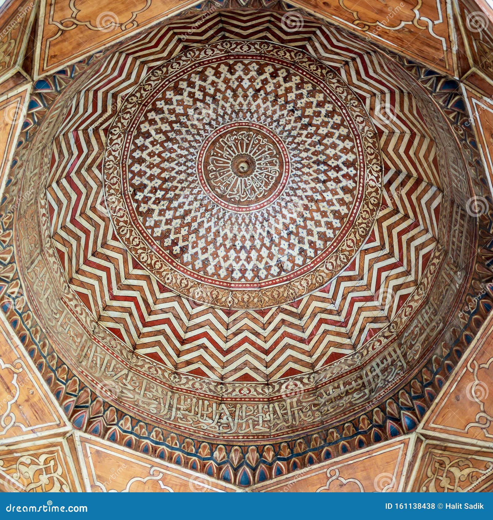 dome decorated with colorful patterns at mamluk era public historic sultan barquq mosque, cairo