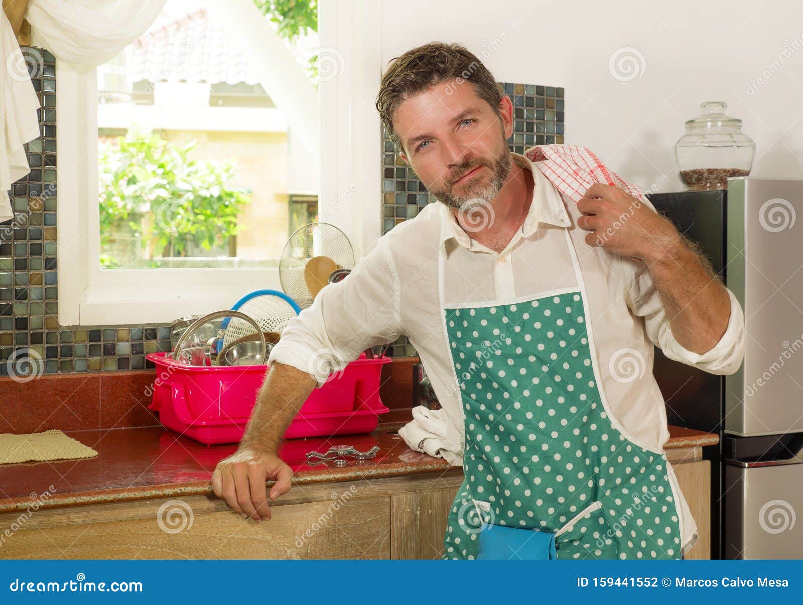 Domestic Chores Lifestyle Portrait Of 30s To 40s Happy And Attractive Man Wearing Kitchen Apron 