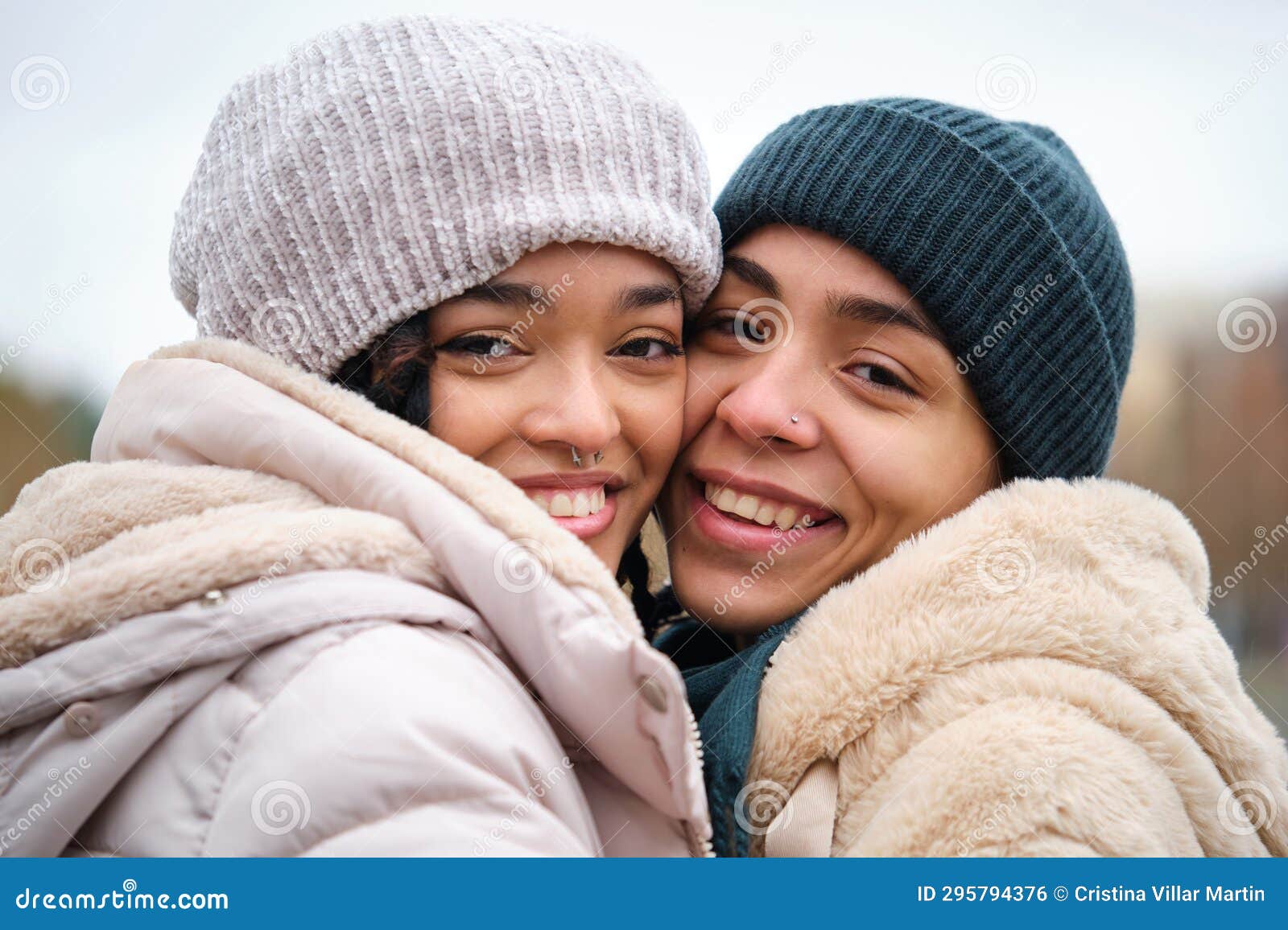 Dominican Lesbian Couple Hugging With Affection And Love At Street In