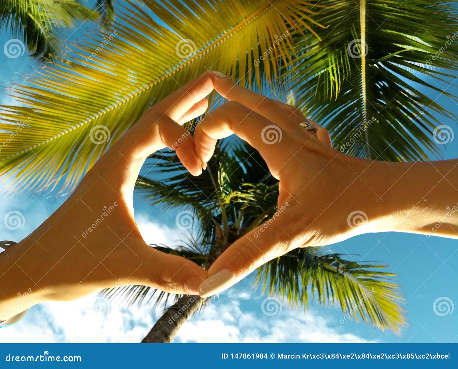 dominican republic, punta cana, mano juan beach. a couple in love doing a heart